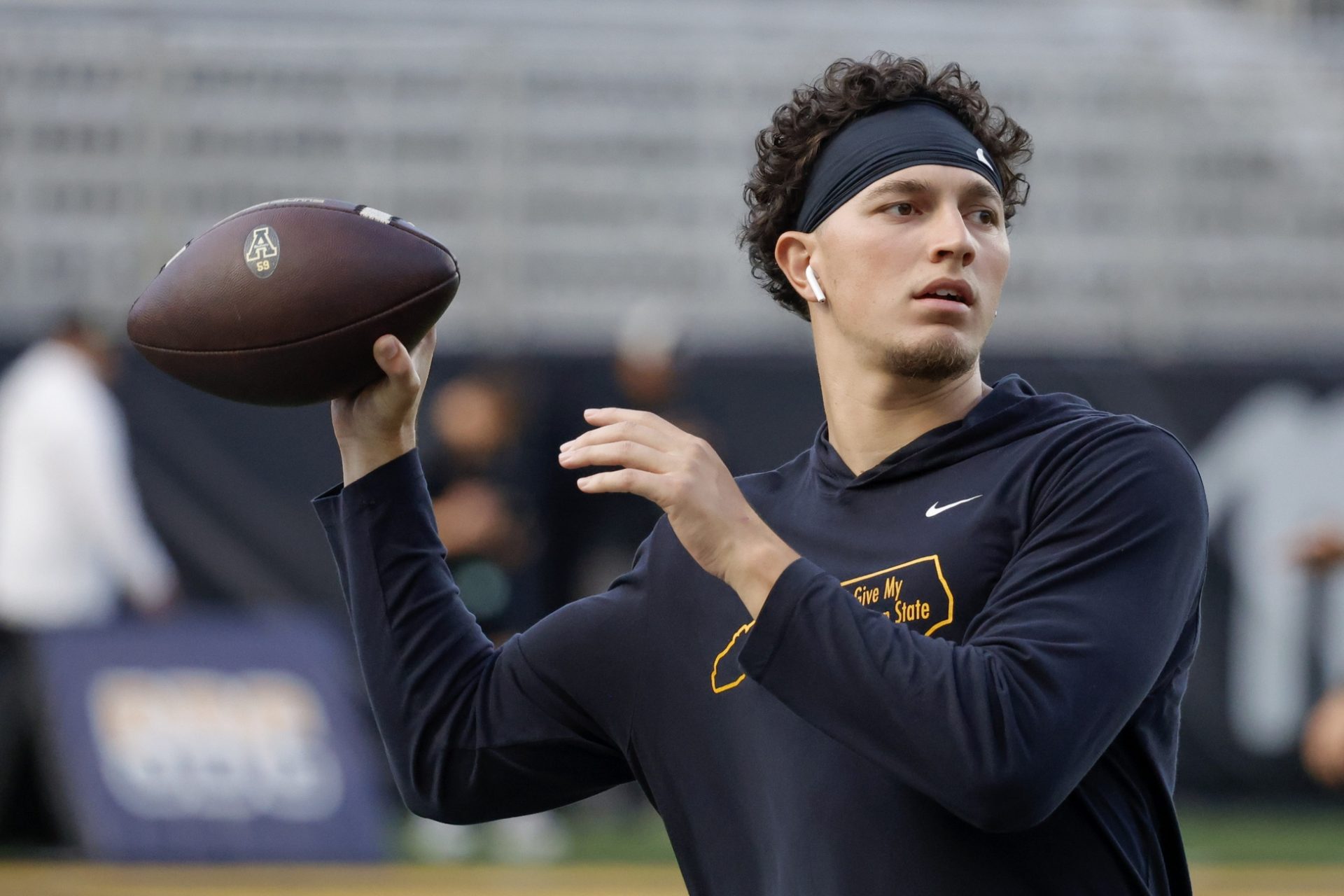 Appalachian State Mountaineers quarterback Joey Aguilar (4) throws a warmup pass before the game against the South Alabama Jaguars at Kidd Brewer Stadium.