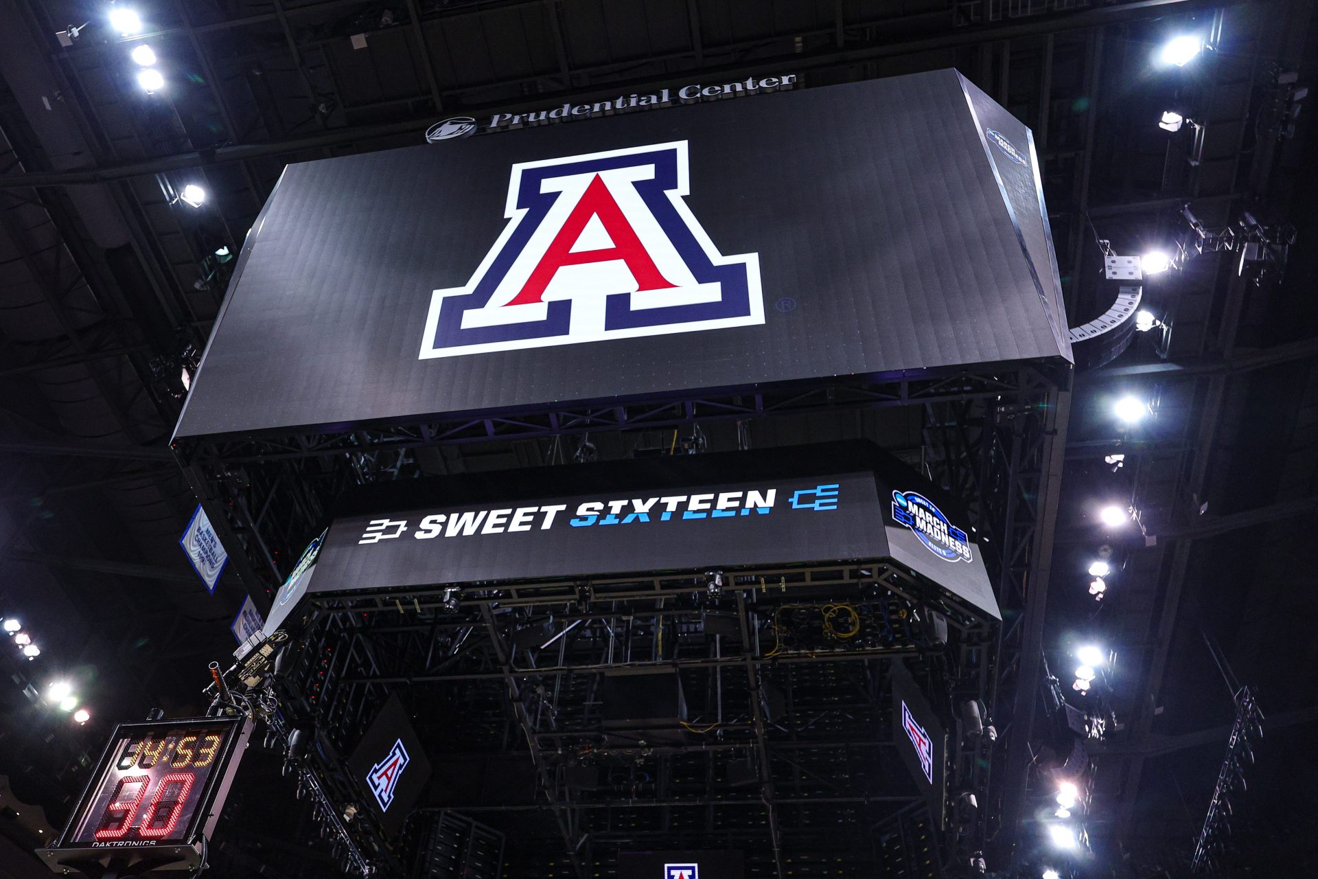An Arizona Wildcats logo on the main scoreboard during a practice session in preparation for an East Regional semifinal game against the Duke Blue Devils at Prudential Center.