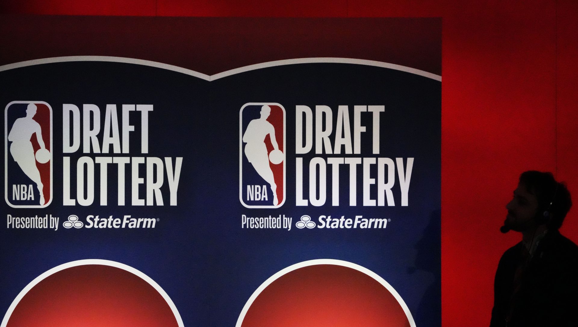 A person watches the 2025 NBA Draft Lottery at McCormick Place.