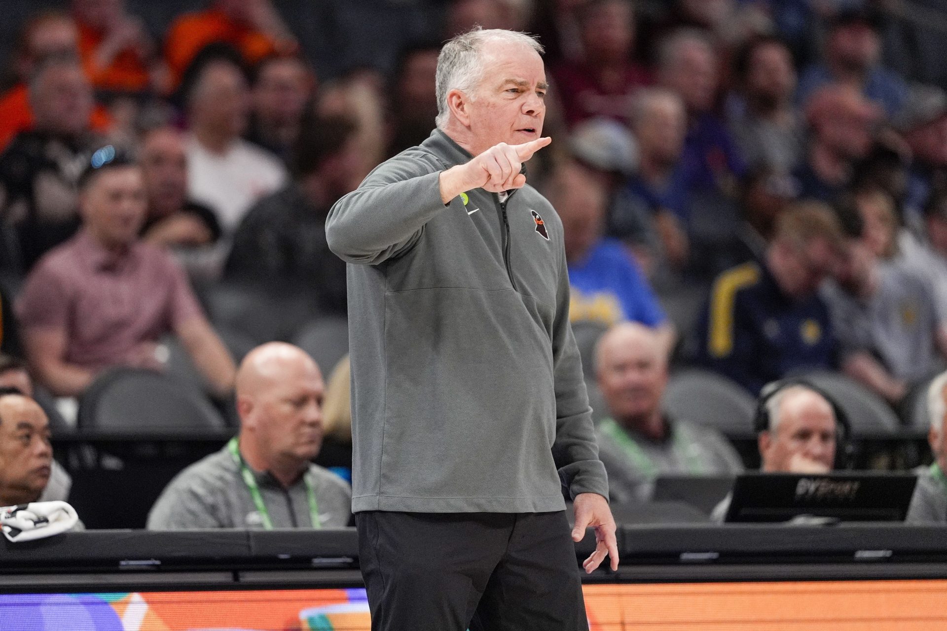 Virginia Tech Hokies head coach Mike Young signals to his team during the first half against the California Golden Bears at Spectrum Center.