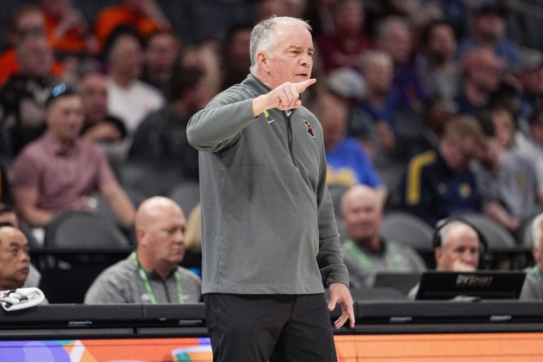 Virginia Tech Hokies head coach Mike Young signals to his team during the first half against the California Golden Bears at Spectrum Center.
