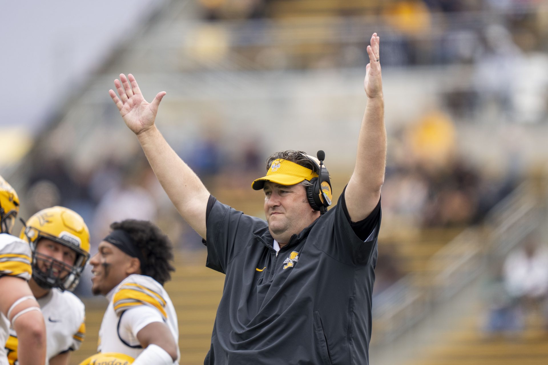 Idaho Vandals head coach Jason Eck signals touchdown against the California Golden Bears during the first quarter at California Memorial Stadium.