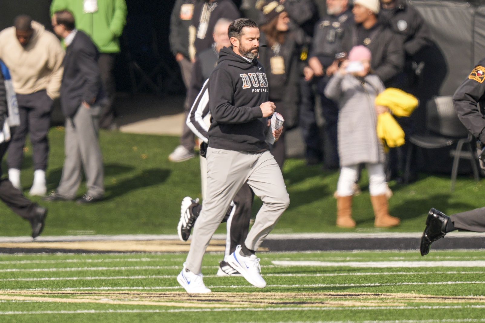Duke Blue Devils head coach Manny Diaz leads his team onto the field against the Wake Forest Demon Deacons  during the first half at Allegacy Federal Credit Union Stadium.