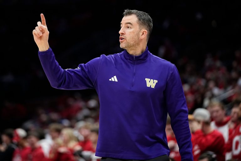 Washington Huskies head coach Danny Sprinkle motions to his team during the first half of the NCAA men's basketball game against the Ohio State Buckeyes at Value City Arena in Columbus on Feb. 12, 2025.