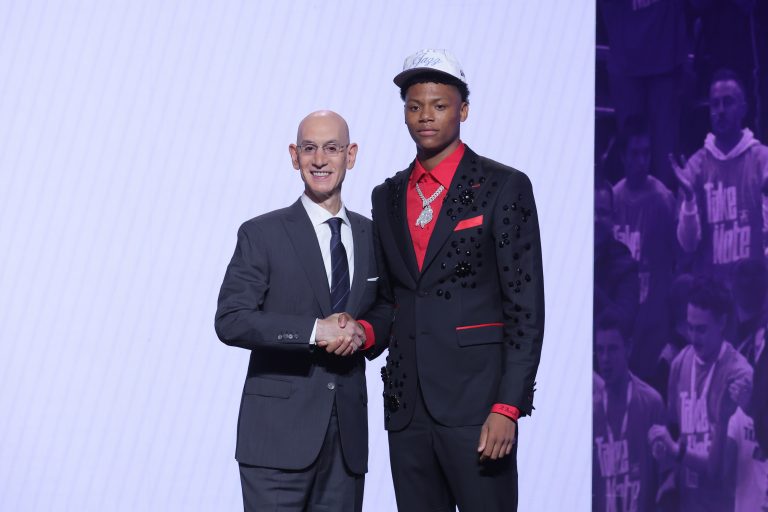 Ace Bailey stands with NBA commissioner Adam Silver after being selected as the fifth pick by the Utah Jazz in the first round of the 2025 NBA Draft at Barclays Center.