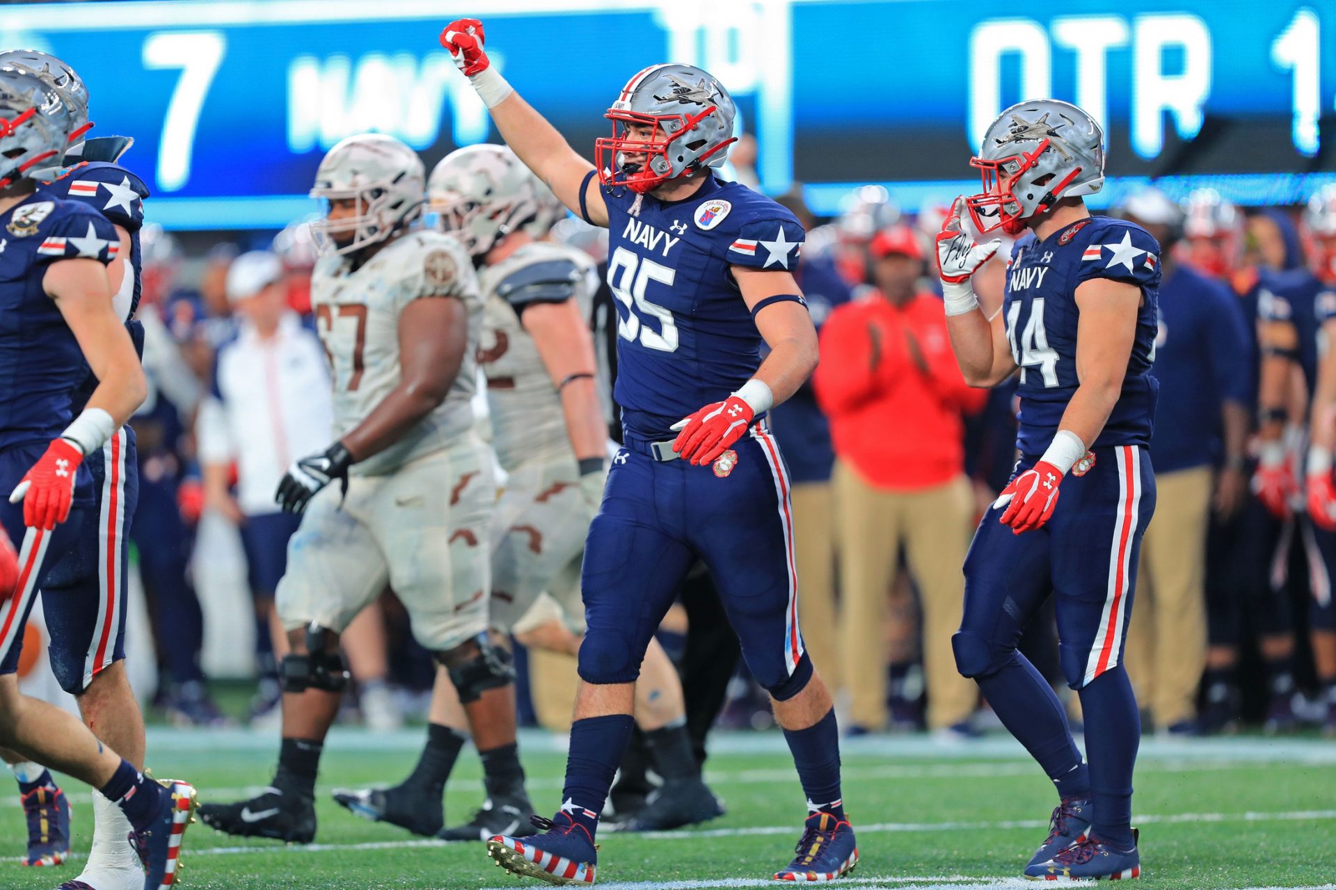 Navy Midshipmen defensive end Jacob Busic (95) celebrates a defensive stop against the Army Black Knights during the first quarter of the 122nd Army-Navy game.