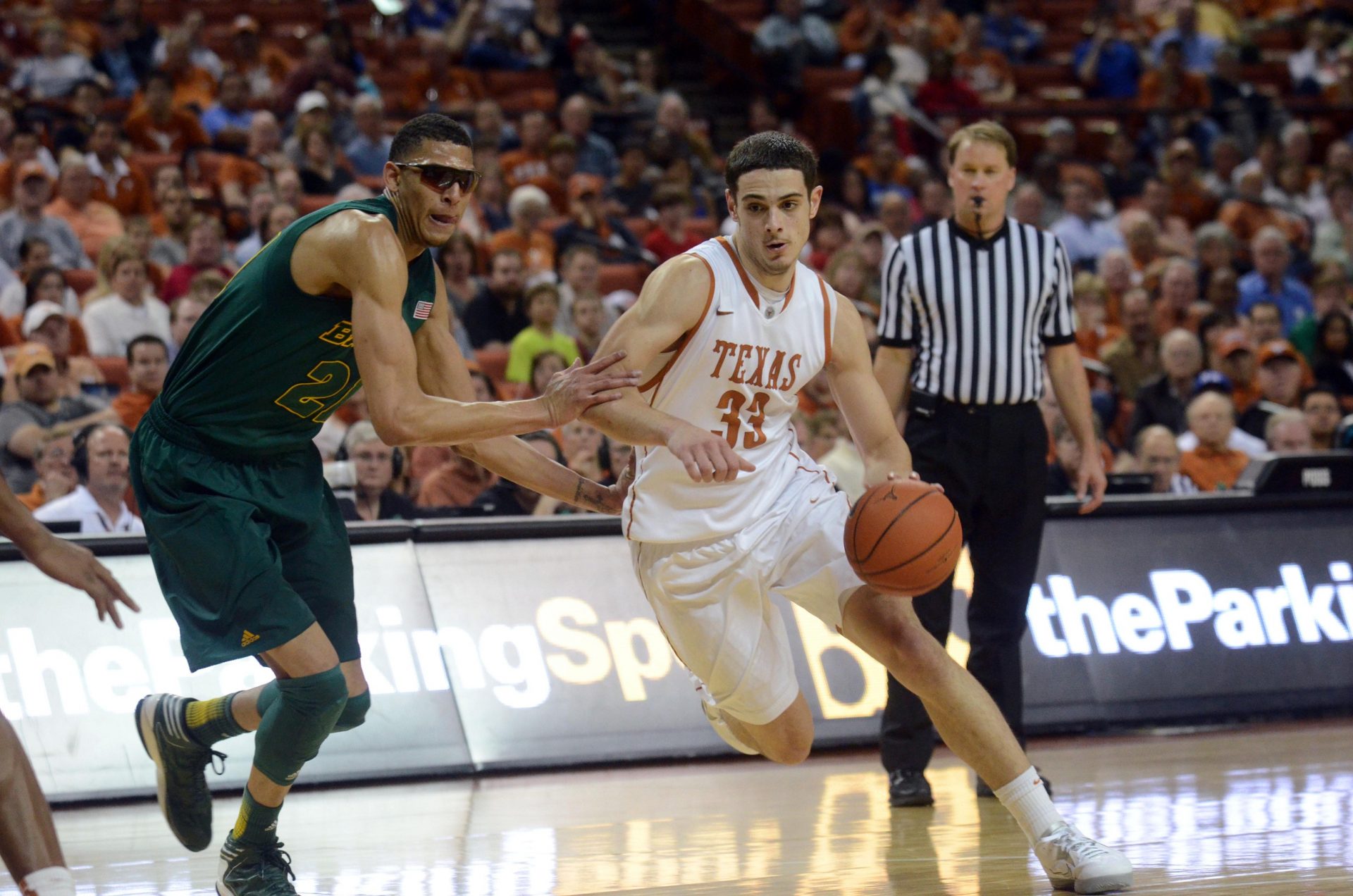 Texas Longhorns forward Ioannis Papapetrou (33) drives against Baylor Bears center Isiah Austin (21) during the second half at the Frank Erwin Special Events Center. Texas beat Baylor 79-70.