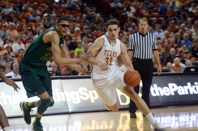 Texas Longhorns forward Ioannis Papapetrou (33) drives against Baylor Bears center Isiah Austin (21) during the second half at the Frank Erwin Special Events Center. Texas beat Baylor 79-70.