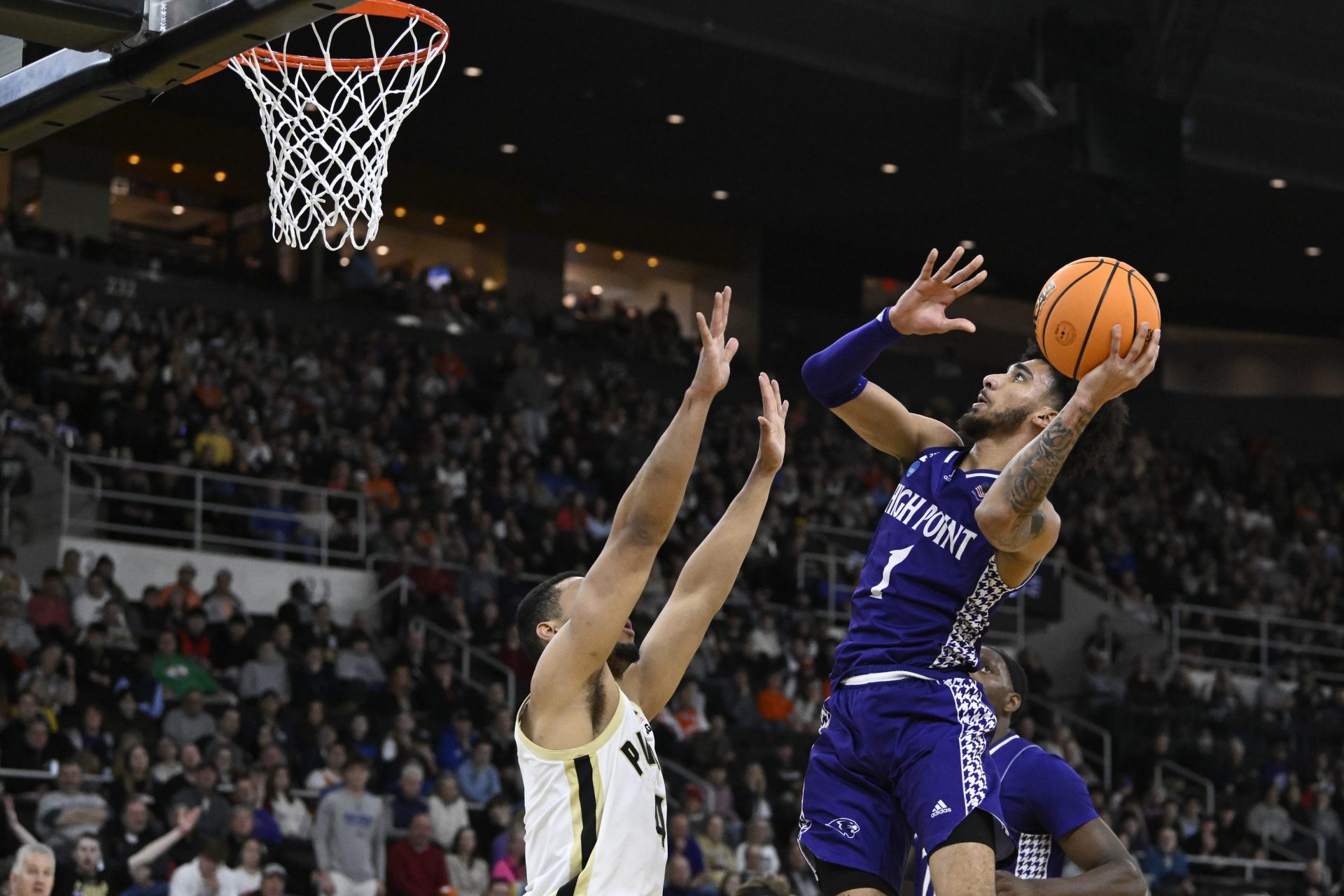 High Point Panthers guard Kezza Giffa (1) shoots the ball over Purdue Boilermakers forward Trey Kaufman-Renn (4) during the first half at Amica Mutual Pavilion.
