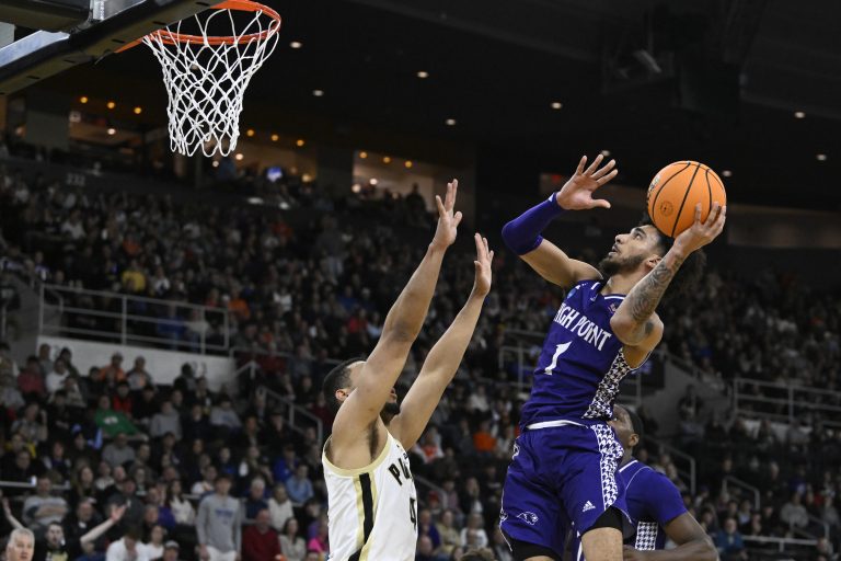 High Point Panthers guard Kezza Giffa (1) shoots the ball over Purdue Boilermakers forward Trey Kaufman-Renn (4) during the first half at Amica Mutual Pavilion.