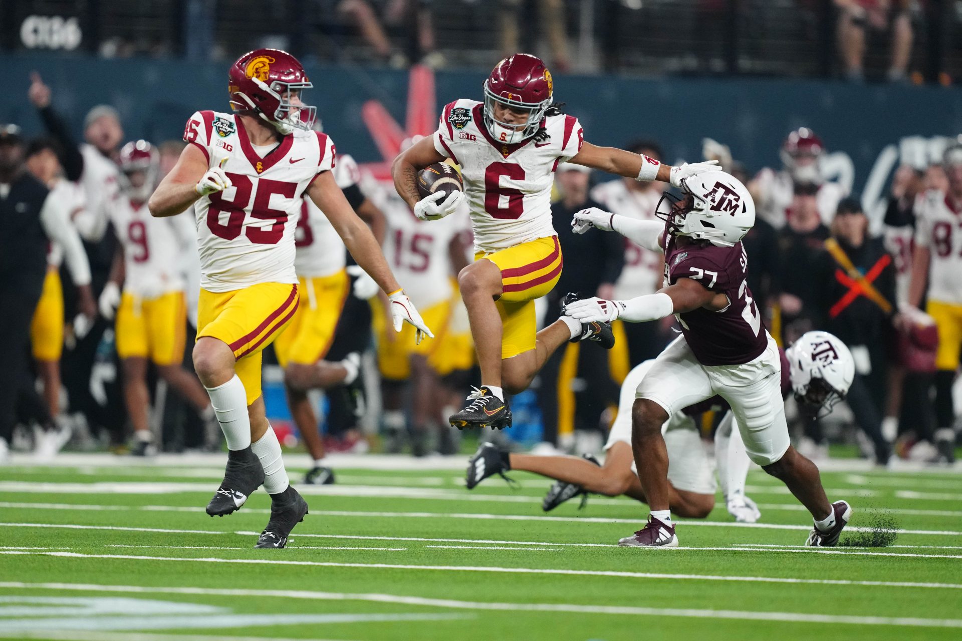 Southern California Trojans wide receiver Makai Lemon (6) carries the ball against Texas A&M Aggies linebacker Daymion Sanford (27) in the second half at Allegiant Stadium.