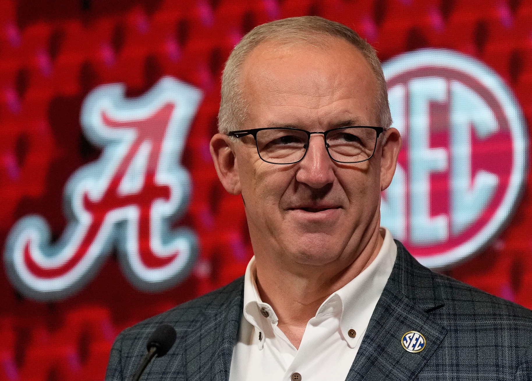 SEC Commissioner Greg Sankey introduces Alabama coach Kirsty Curry during SEC Media Day at the Grand Bohemian Hotel in Mountain Brook Tuesday, Oct. 16, 2024.