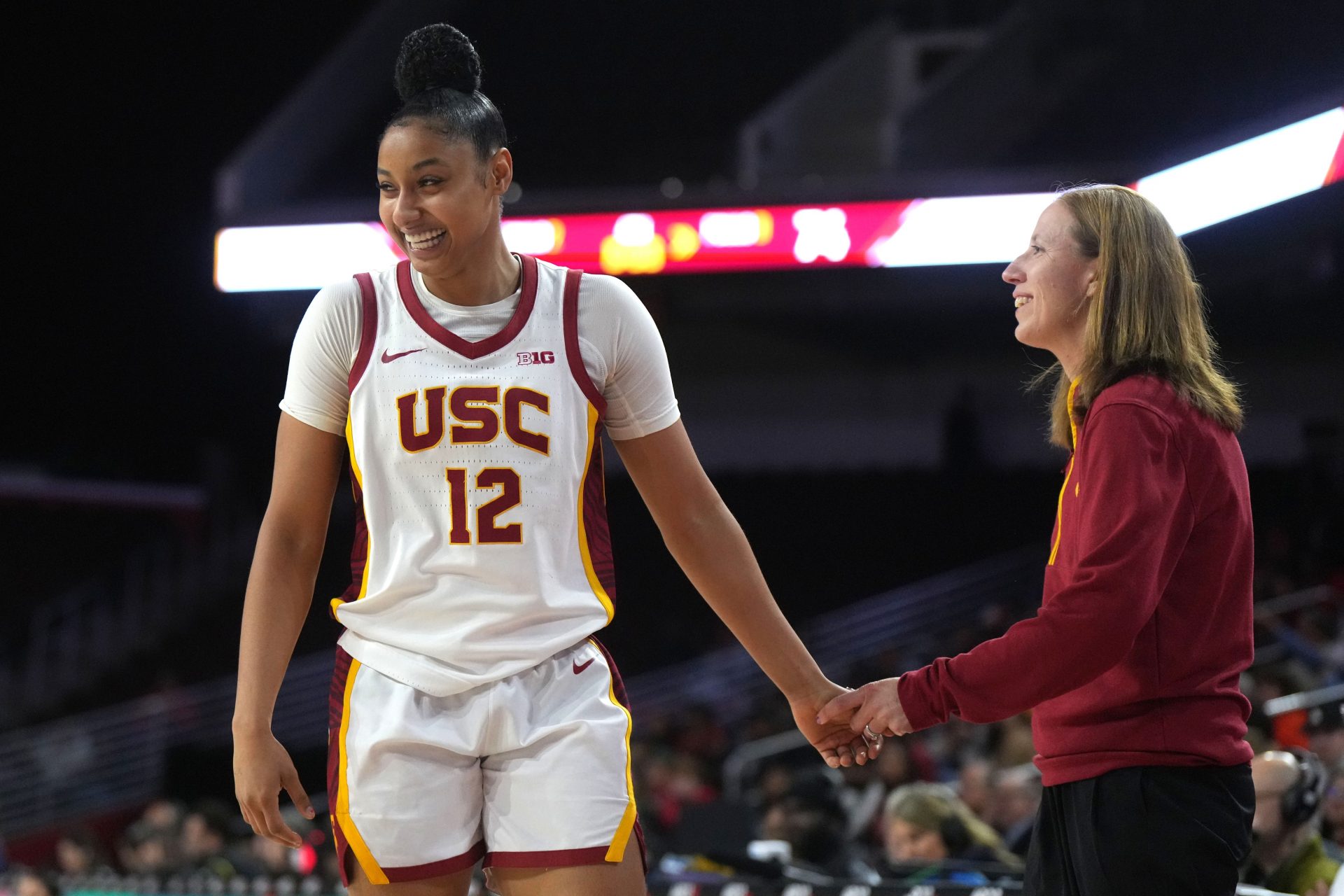 Southern California Trojans guard JuJu Watkins (12) celebrates with head coach Lindsay Gottlieb in the fourth quarter against the Fresno State Bulldogs at Galen Center. USC defeated Fresno State 89-40.