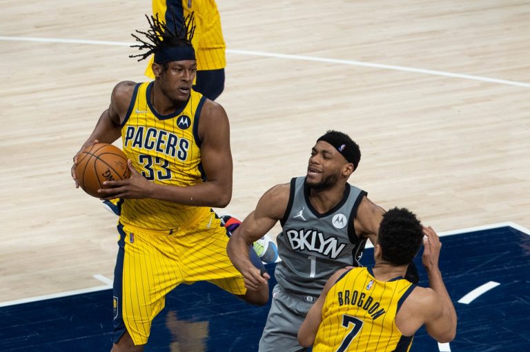 Indiana Pacers center Myles Turner (33) rebounds the ball over Brooklyn Nets guard Bruce Brown (1)  in the third quarter at Bankers Life Fieldhouse.