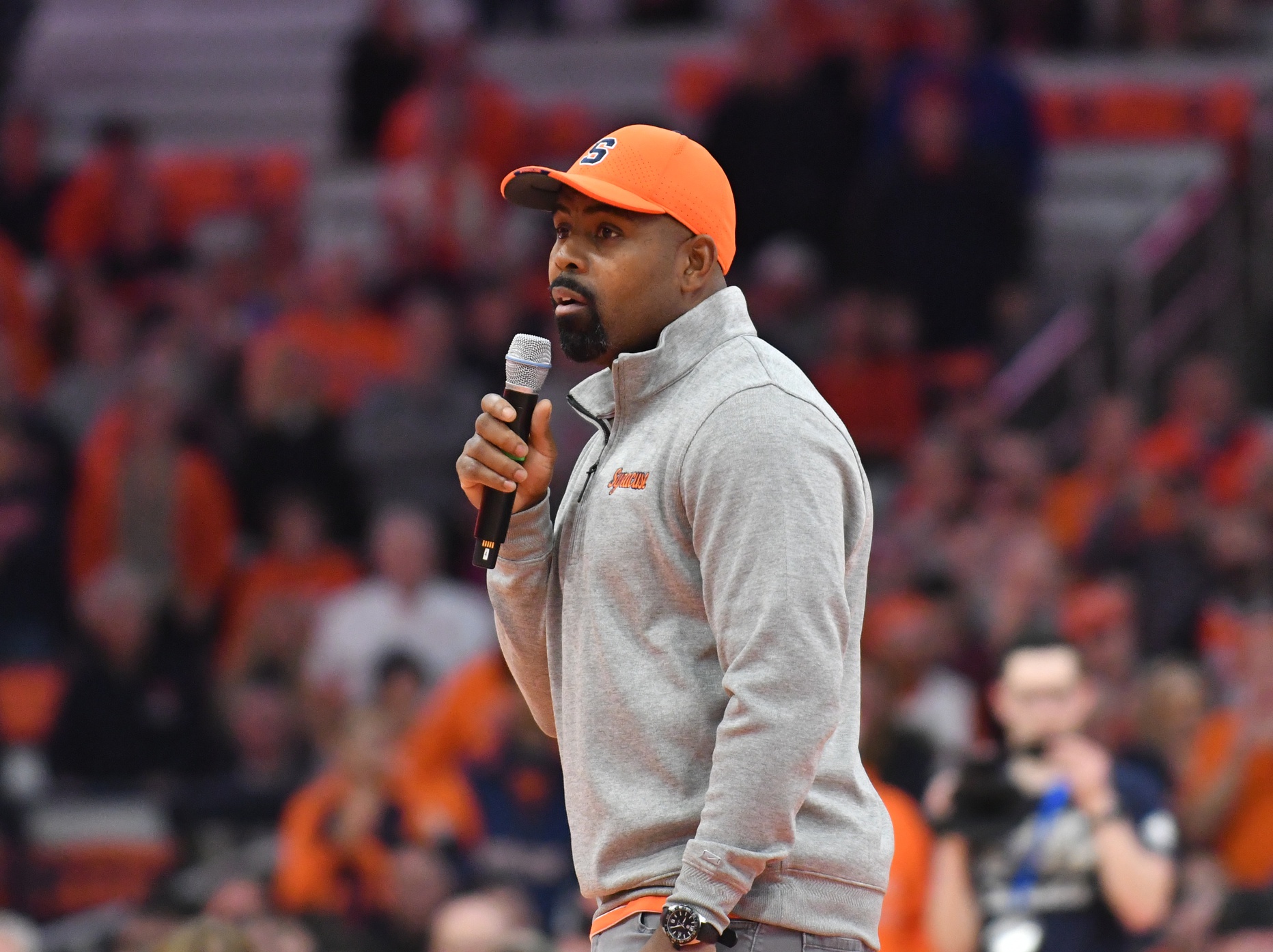 New Syracuse Orange head football coach Fran Brown addresses the crowd during a timeout in the first half of a basketball game between the Syracuse Orange and the Cornell Big Red at the JMA Wireless Dome.