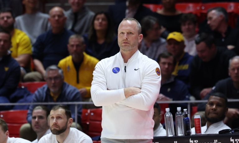 West Virginia Mountaineers head coach Darian DeVries watches the play against the Utah Utes during the first half at Jon M. Huntsman Center.