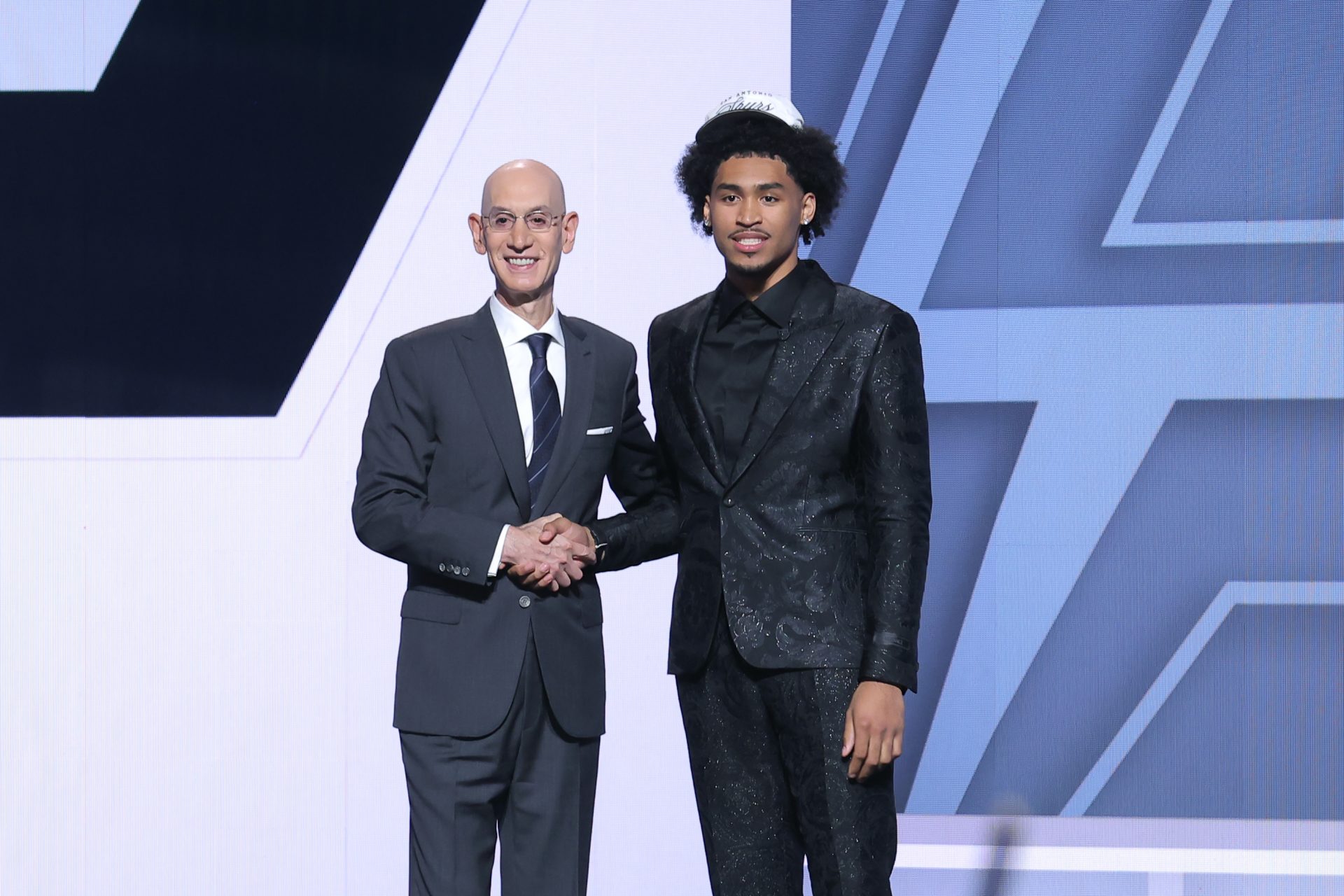 Dylan Harper stands with NBA commissioner Adam Silver after being selected as the second pick by the San Antonio Spurs in the first round of the 2025 NBA Draft at Barclays Center.