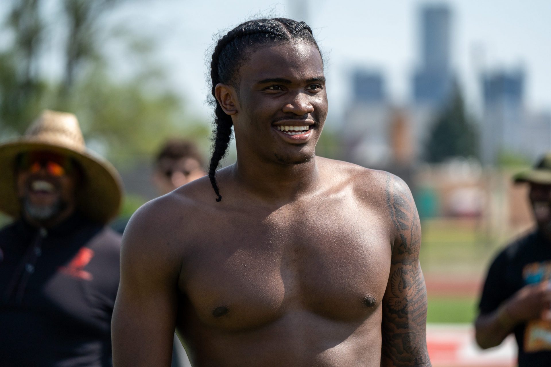 Bryce Underwood, 17, a freshman quarterback at the University of Michigan and the nation’s No. 1 recruit in the 2025 class, smiles as he participates in a football drill during a private workout in Detroit on Saturday, June 21, 2025.