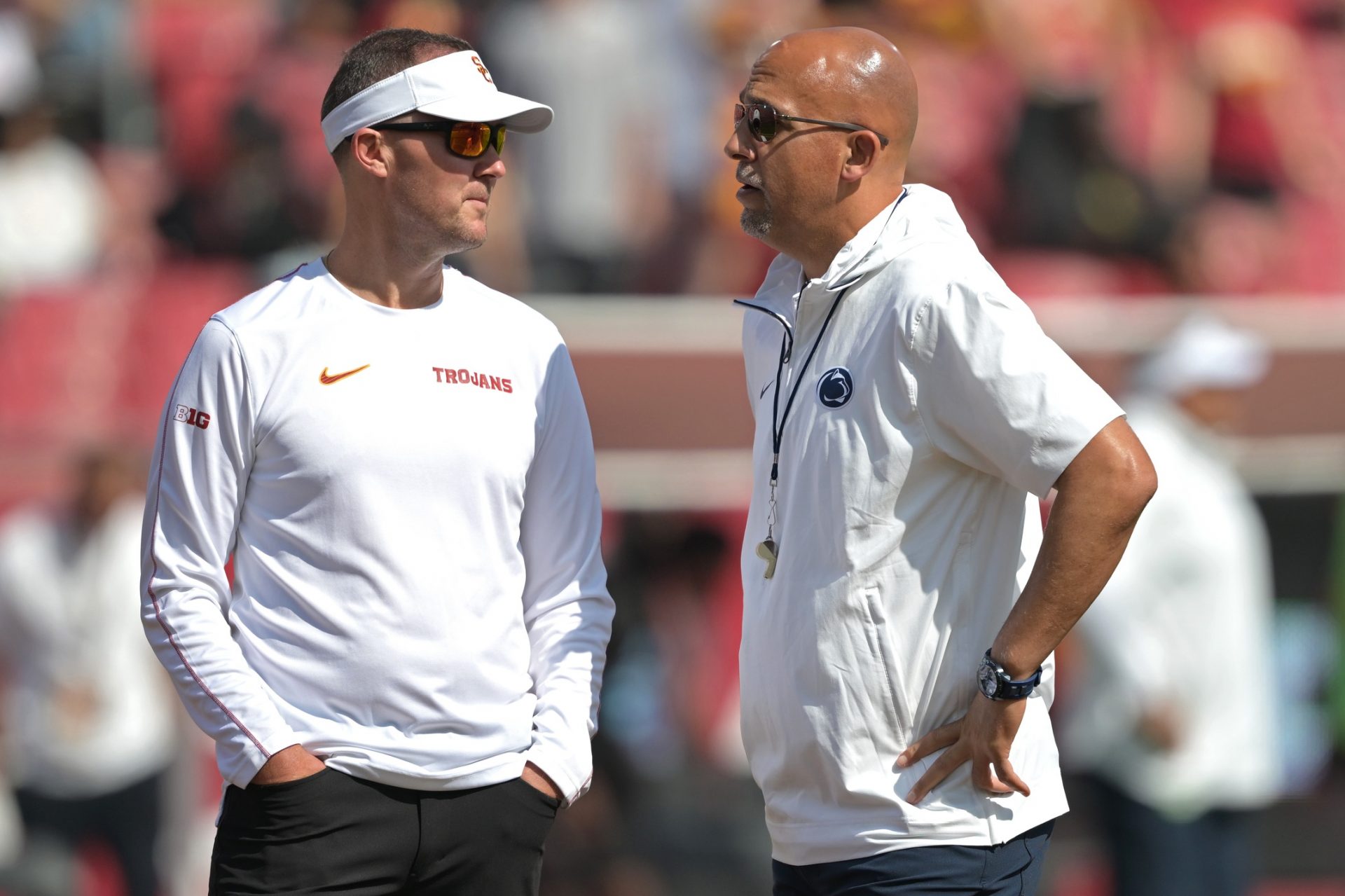 USC Trojans head coach Lincoln Riley, left, talks with Penn State Nittany Lions head coach James Franklin on the field prior to the game at United Airlines Field at Los Angeles Memorial Coliseum.