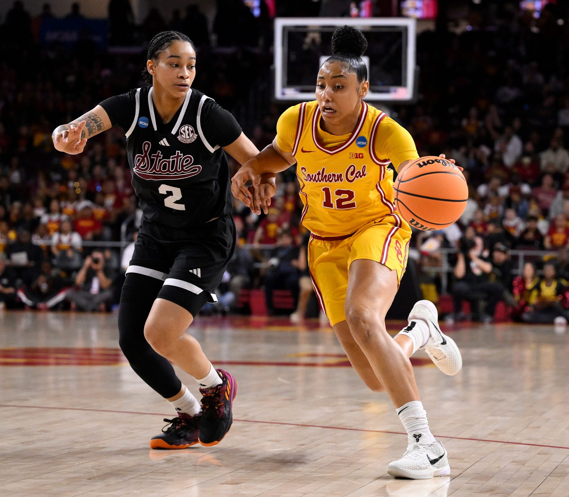 USC Trojans guard JuJu Watkins (12) drives to the basket past Mississippi State Bulldogs guard Jerkaila Jordan (2) during the first quieter of an NCAA Tournament second round game at Galen Center.