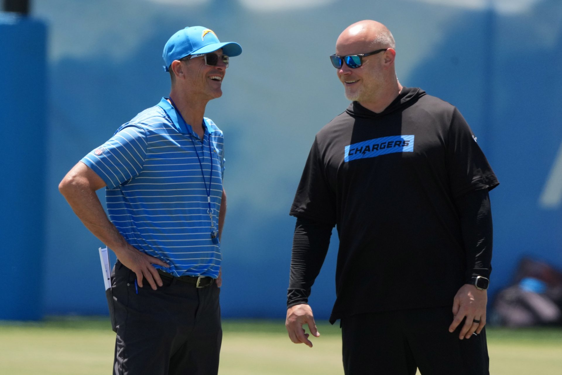 Los Angeles Chargers coach Jim Harbaugh (left) and executive director of player performance Ben Herbert during organized team activities at The Bolt.
