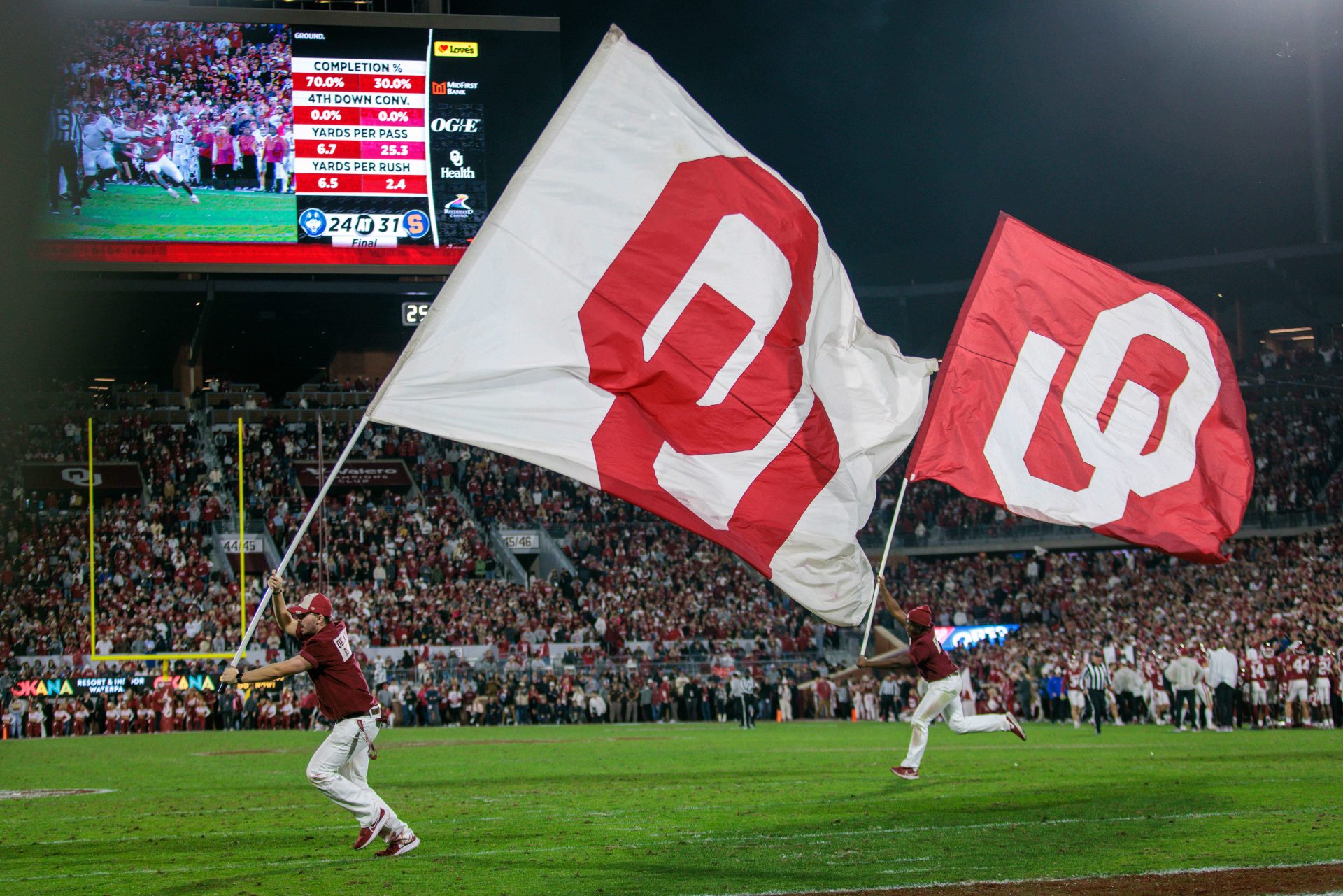 Oklahoma Sooners flags on the field after a touchdown during the fourth quarter against the Alabama Crimson Tide at Gaylord Family-Oklahoma Memorial Stadium.