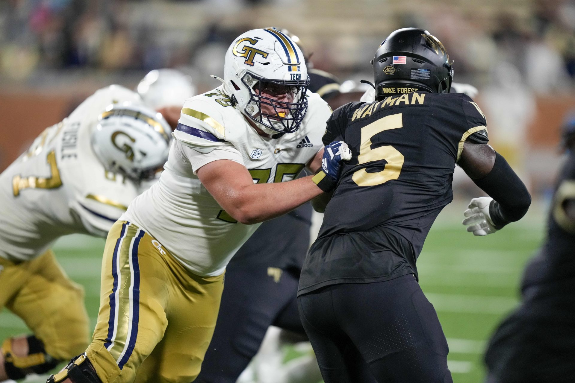 Georgia Tech Yellow Jackets offensive lineman Jakiah Leftwich (75) blocks Wake Forest Demon Deacons defensive lineman Kendron Wayman (5) during the second half at Allegacy Federal Credit Union Stadium.