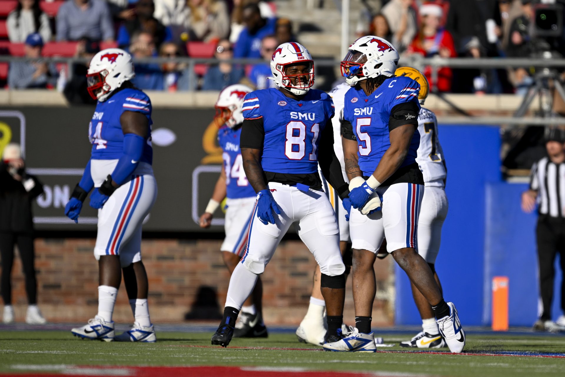 Southern Methodist Mustangs defensive lineman Jared Harrison-Hunte (81) and defensive end Elijah Roberts (5) in action during the game between the SMU Mustangs and the California Golden Bears at Gerald J. Ford Stadium.
