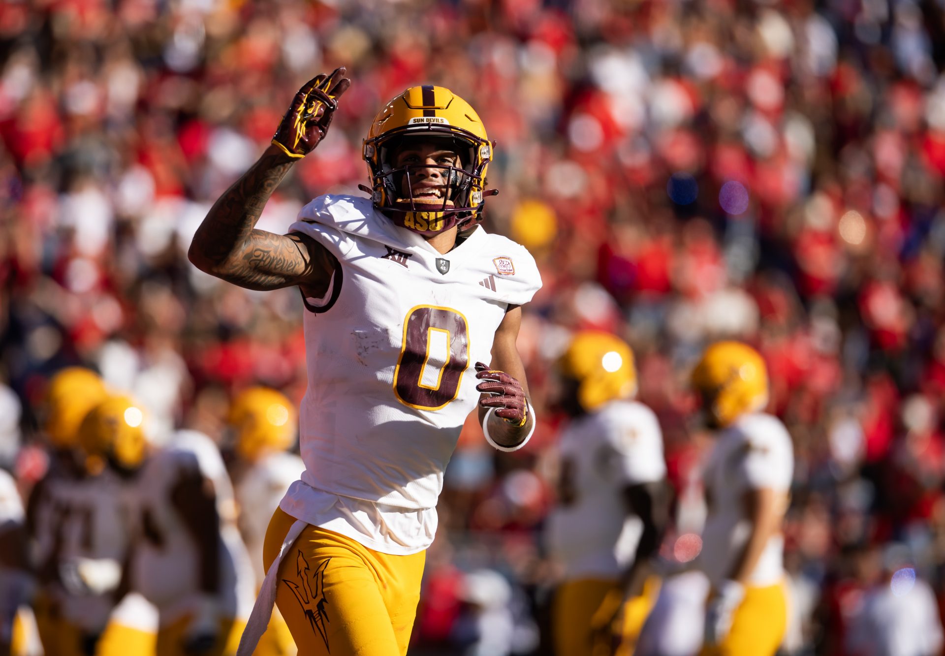 Arizona State Sun Devils wide receiver Jordyn Tyson (0) celebrates a touchdown against the Arizona Wildcats in the first half during the Territorial Cup at Arizona Stadium.