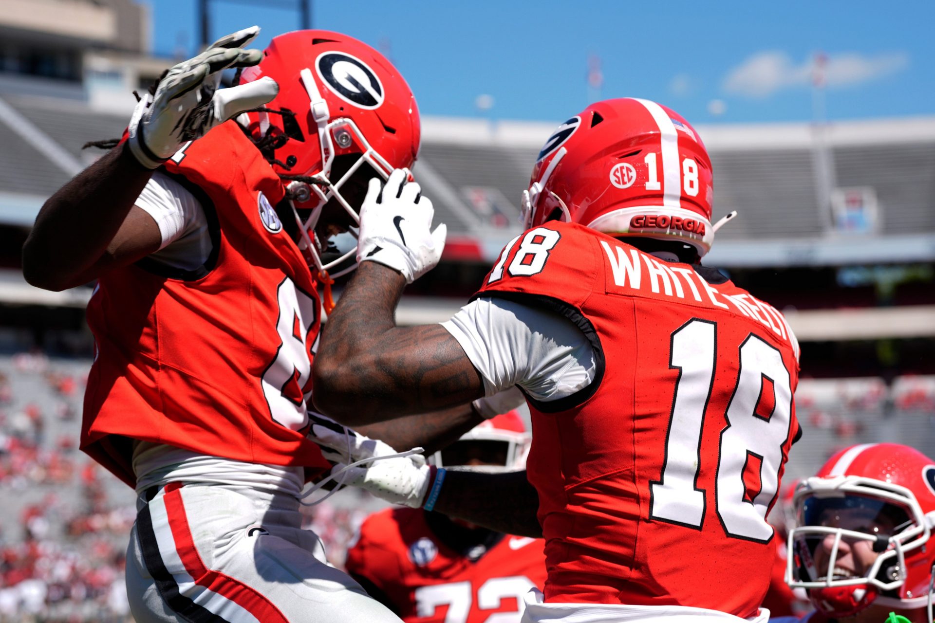 Georgia wide receiver Sacovie White (18) celebrates with his teammates after scoring a touchdown during the Georgia G-Day spring football game in Athens, Ga., on Saturday, April 12, 2025.