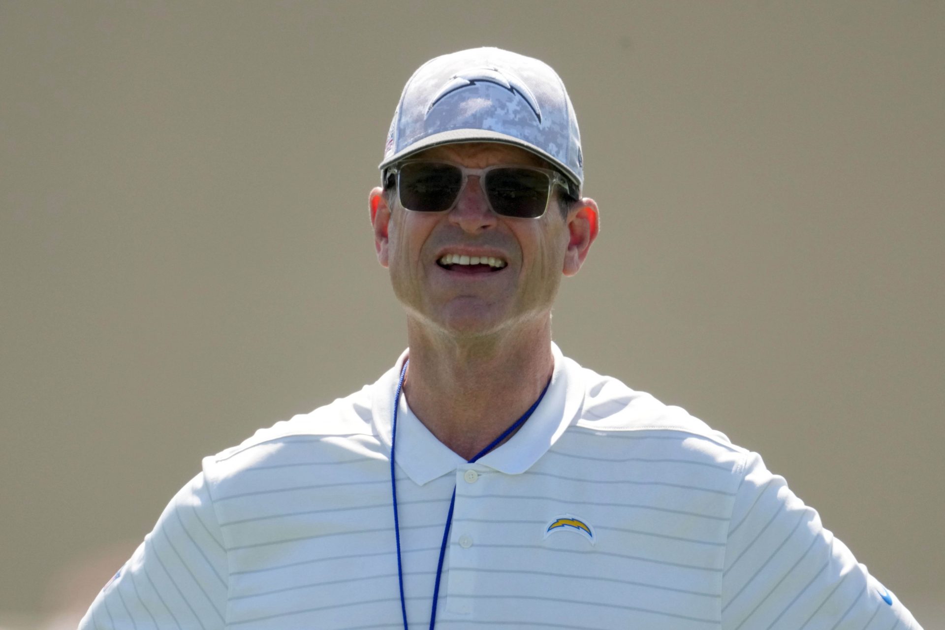 Los Angeles Chargers coach Jim Harbaugh looks on during offseason workouts at The Bolt.