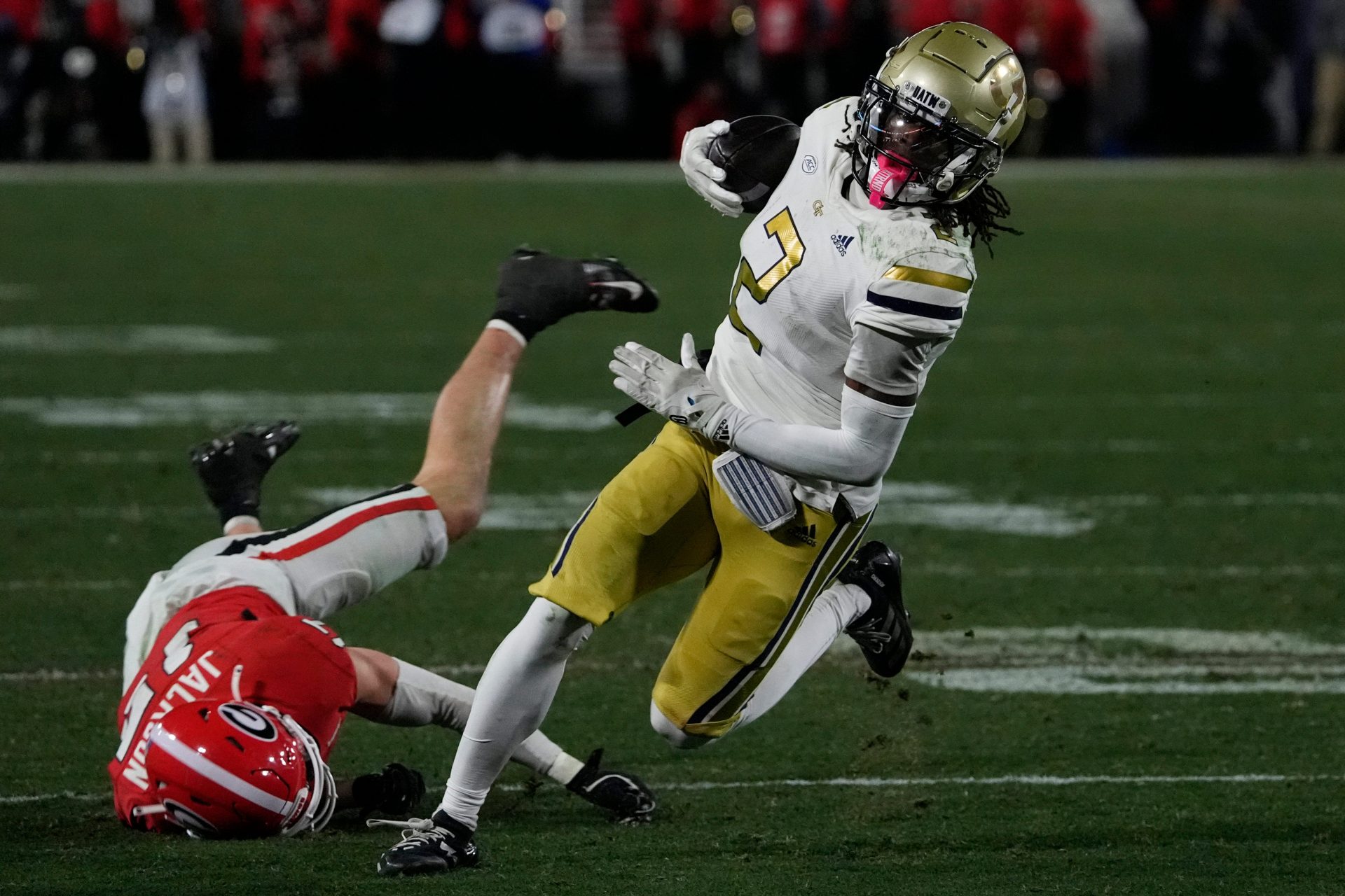 Georgia Tech wide receiver Eric Singleton Jr. (2) moves the ball down the field during the first half of a NCAA college football game against Georgia Tech in Athens, Ga., on Friday, Nov. 29, 2024.