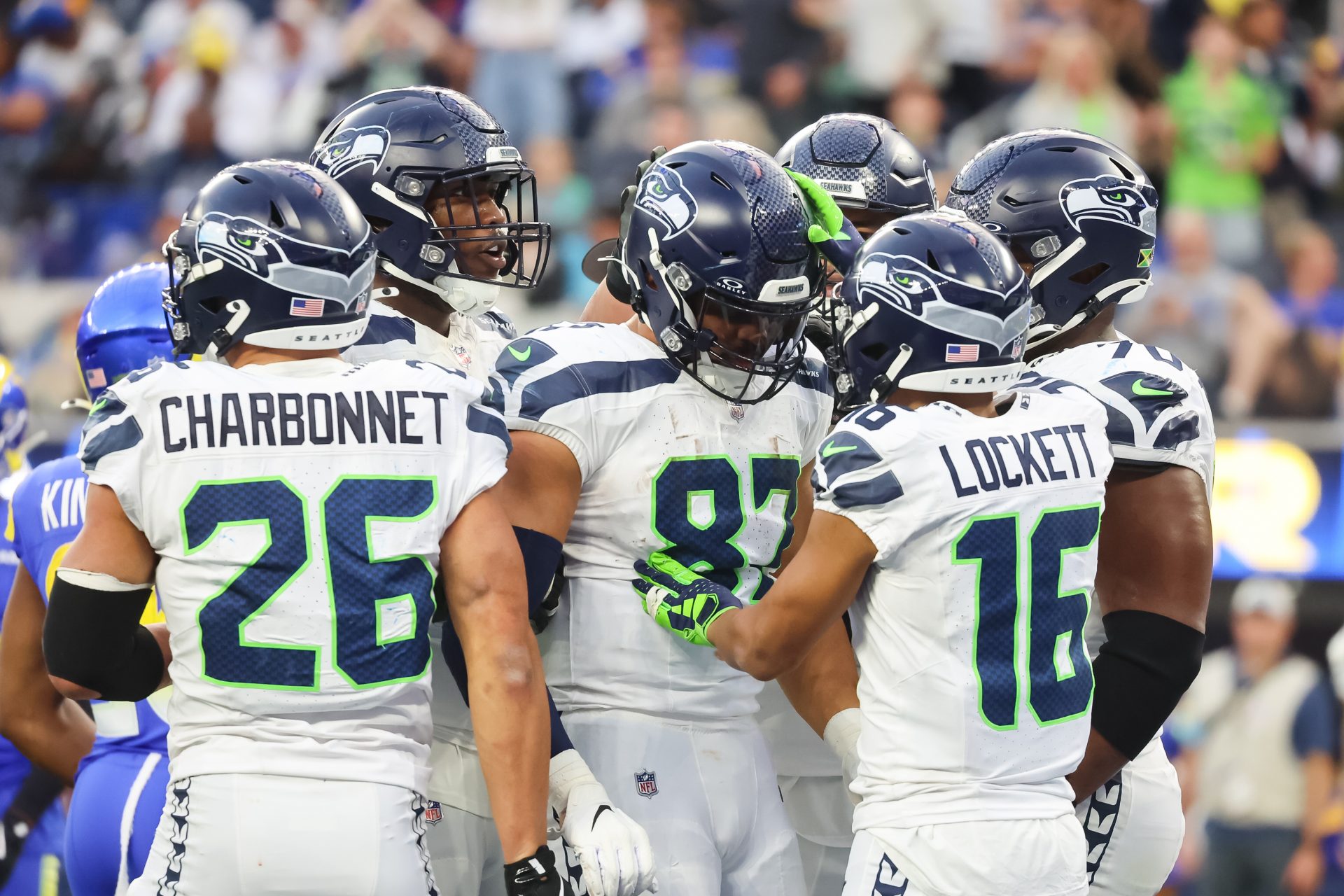 Seattle Seahawks teammates make sure tight end Noah Fans (87) is ok after a brutal fall from a tackle at SoFi Stadium for the Seattle Seahawks at Los Angeles Rams Week 18 matchup.