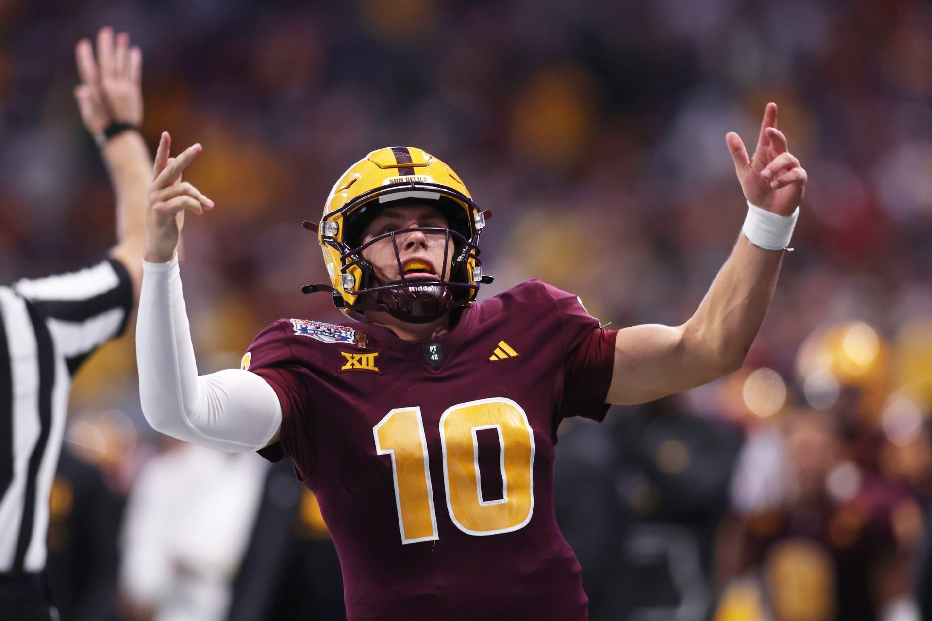 Arizona State Sun Devils quarterback Sam Leavitt (10) reacts after a play against the Texas Longhorns during the second half of the Peach Bowl at Mercedes-Benz Stadium.
