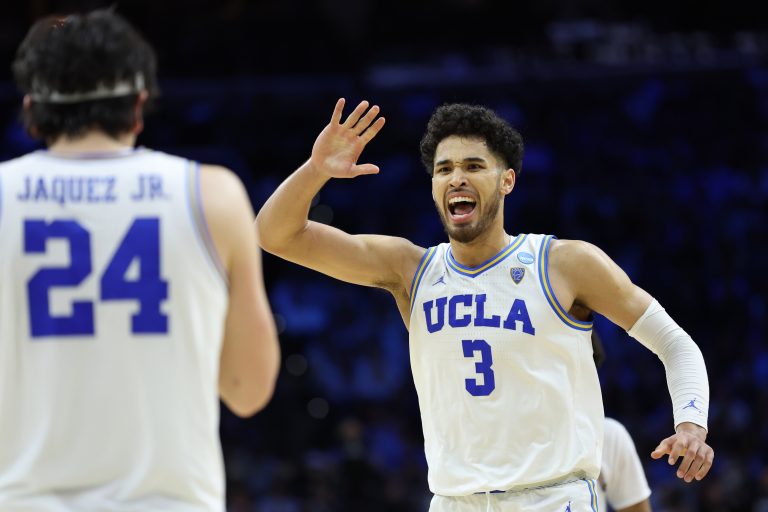 UCLA Bruins guard Johnny Juzang (3) and guard Jaime Jaquez Jr. (24) react in the second half against the North Carolina Tar Heels in the semifinals of the East regional of the men's college basketball NCAA Tournament at Wells Fargo Center.
