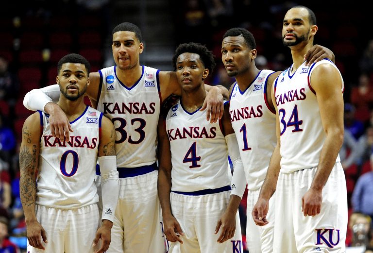 Kansas Jayhawks guard Frank Mason III (0), forward Landen Lucas (33), guard Devonte' Graham (4), guard Wayne Selden Jr. (1) and forward Perry Ellis (34) on the court in the second half against the Connecticut Huskies during the second round of the 2016 NCAA Tournament at Wells Fargo Arena.