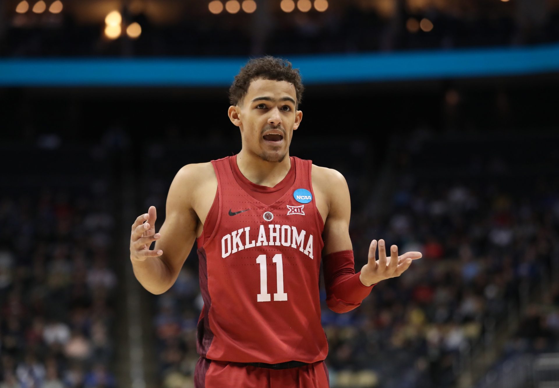 Oklahoma Sooners guard Trae Young (11) reacts against the Rhode Island Rams during the first half in the first round of the 2018 NCAA Tournament at PPG Paints Arena.