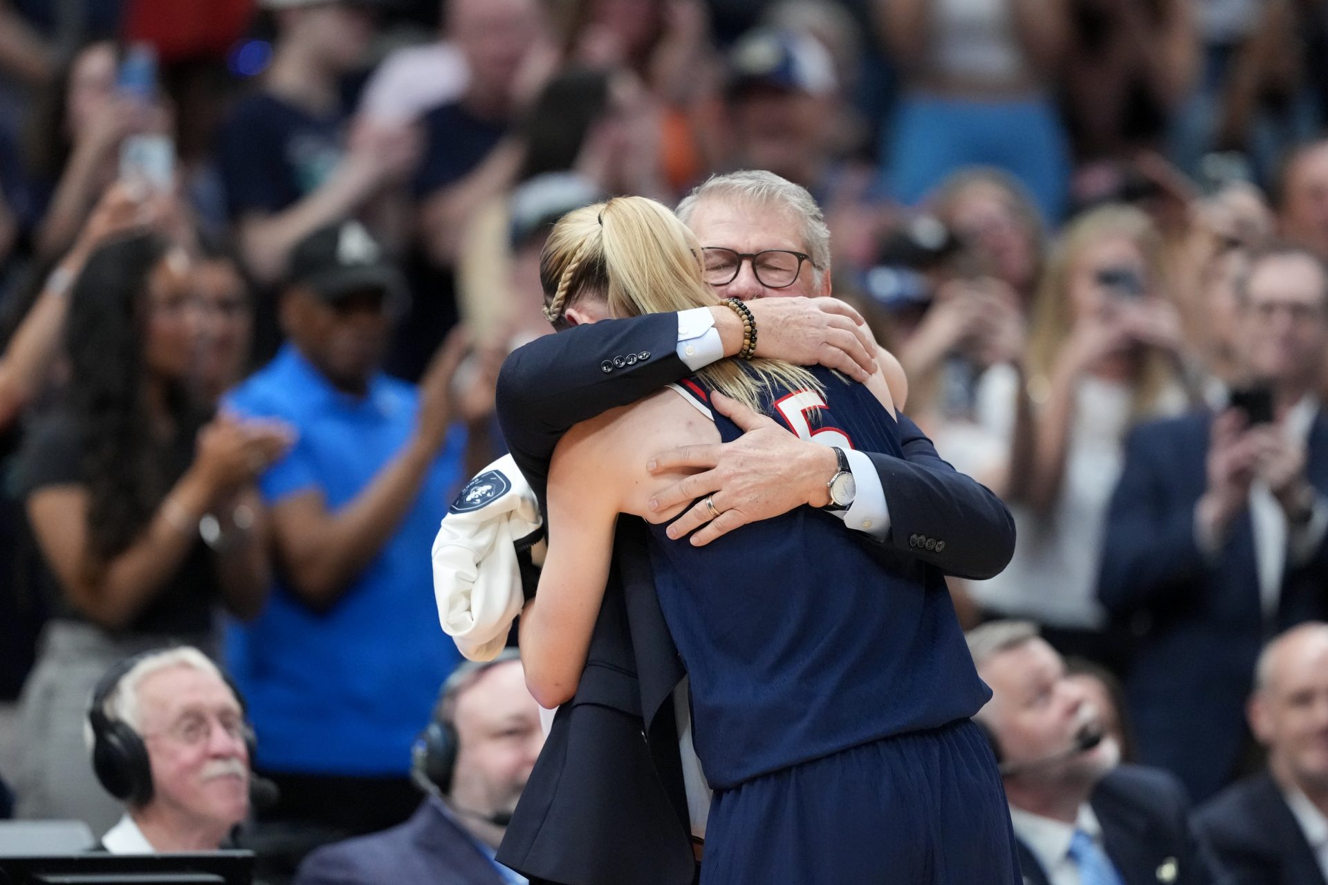 Connecticut Huskies head coach Geno Auriemma hugs guard Paige Bueckers (5) during the second half against the South Carolina Gamecocks of the national championship of the women's 2025 NCAA tournament at Amalie Arena.