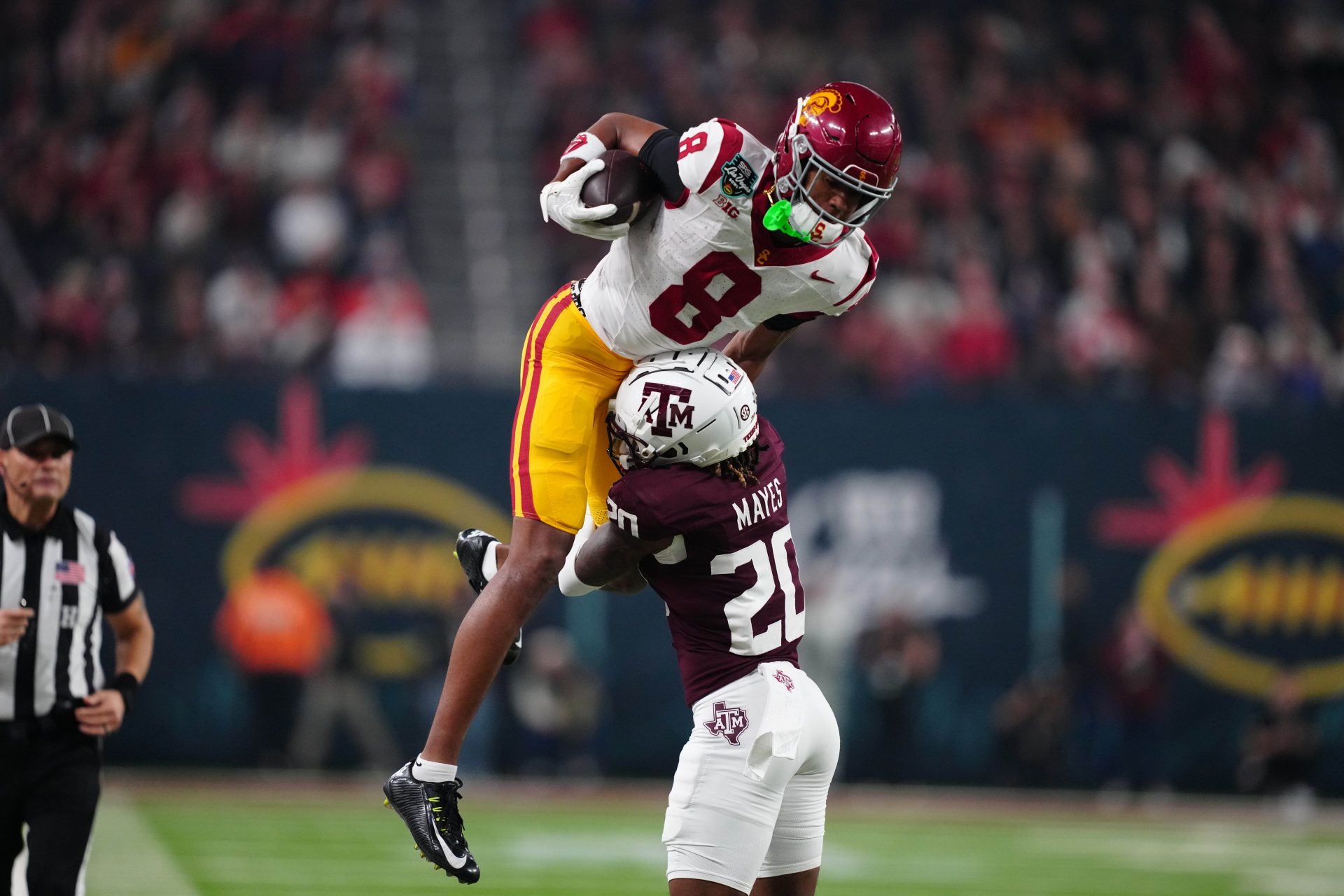 Southern California Trojans wide receiver Ja'Kobi Lane (8) catches the ball against Texas A&M Aggies defensive back BJ Mayes (20) in the second half at Allegiant Stadium.