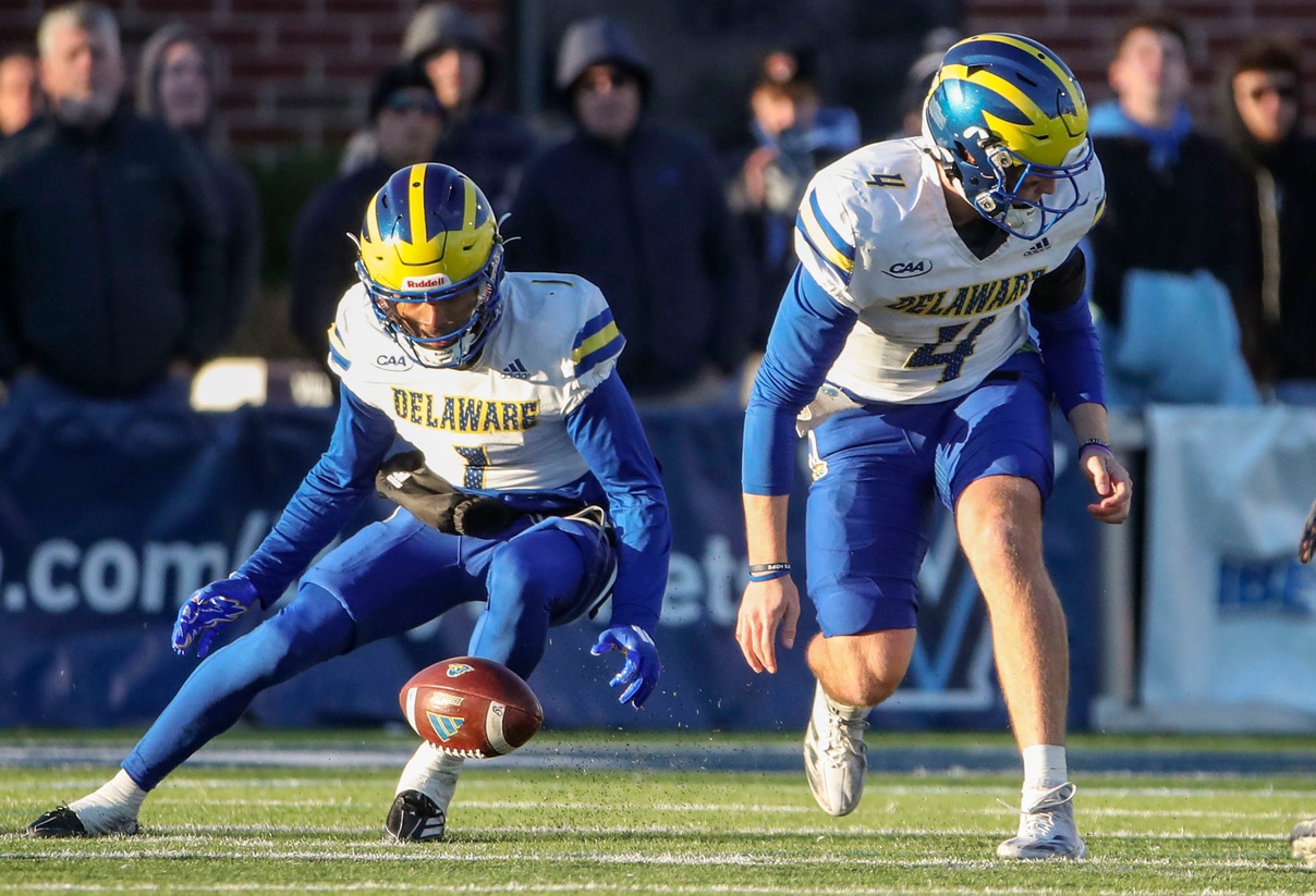 Delaware receiver JoJo Bermudez (left) and quarterback Nick Minicucci can't come up with a fumble by Minicucci in the fourth quarter of the Blue Hens' 38-28 loss against Villanova at Villanova Stadium, Saturday, Nov. 23, 2024.