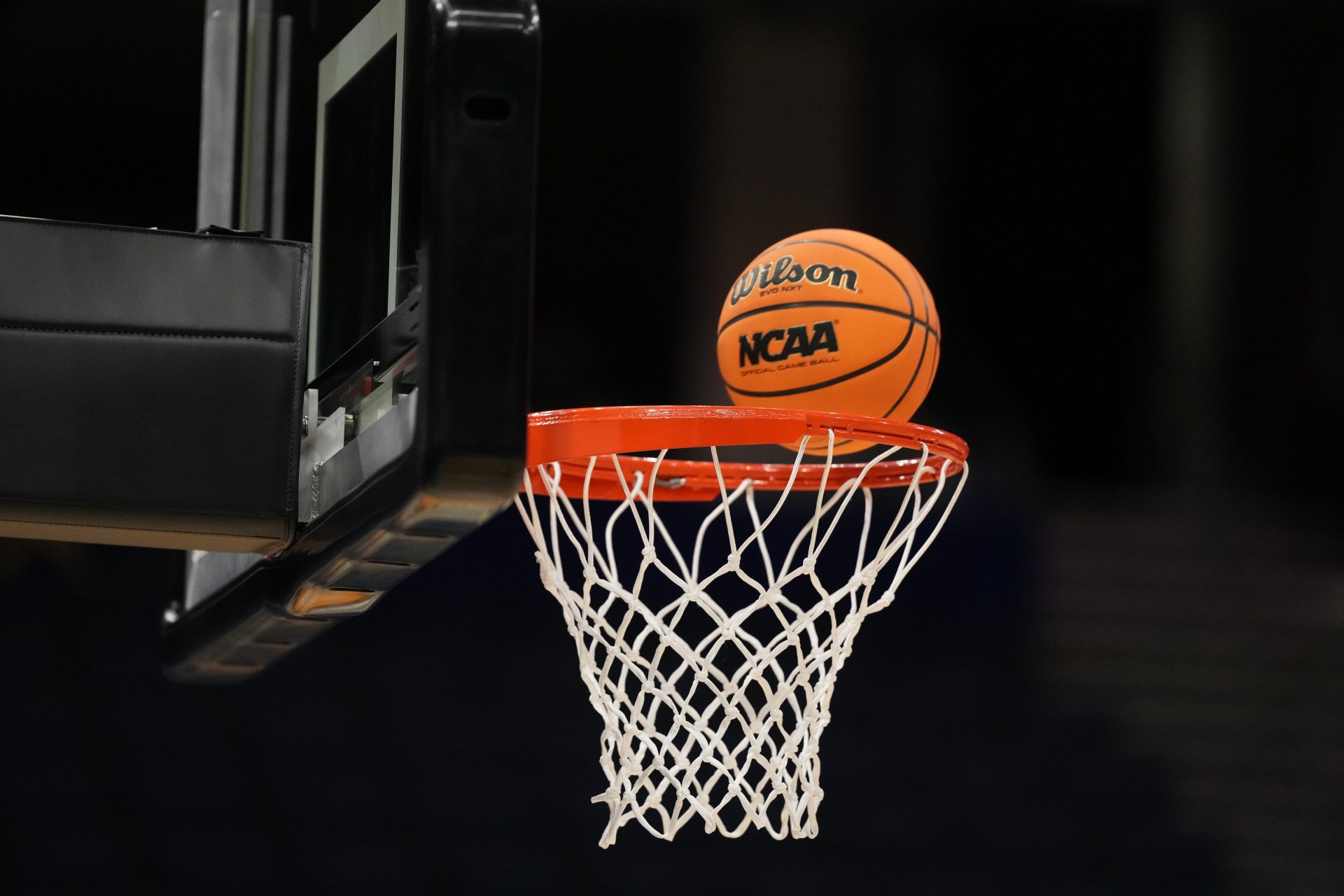 A Wilson EVO Nxt basketball ball with the 2025 NCAA Women's Final Four logo approaches the rim and the net at Amalie Arena.
