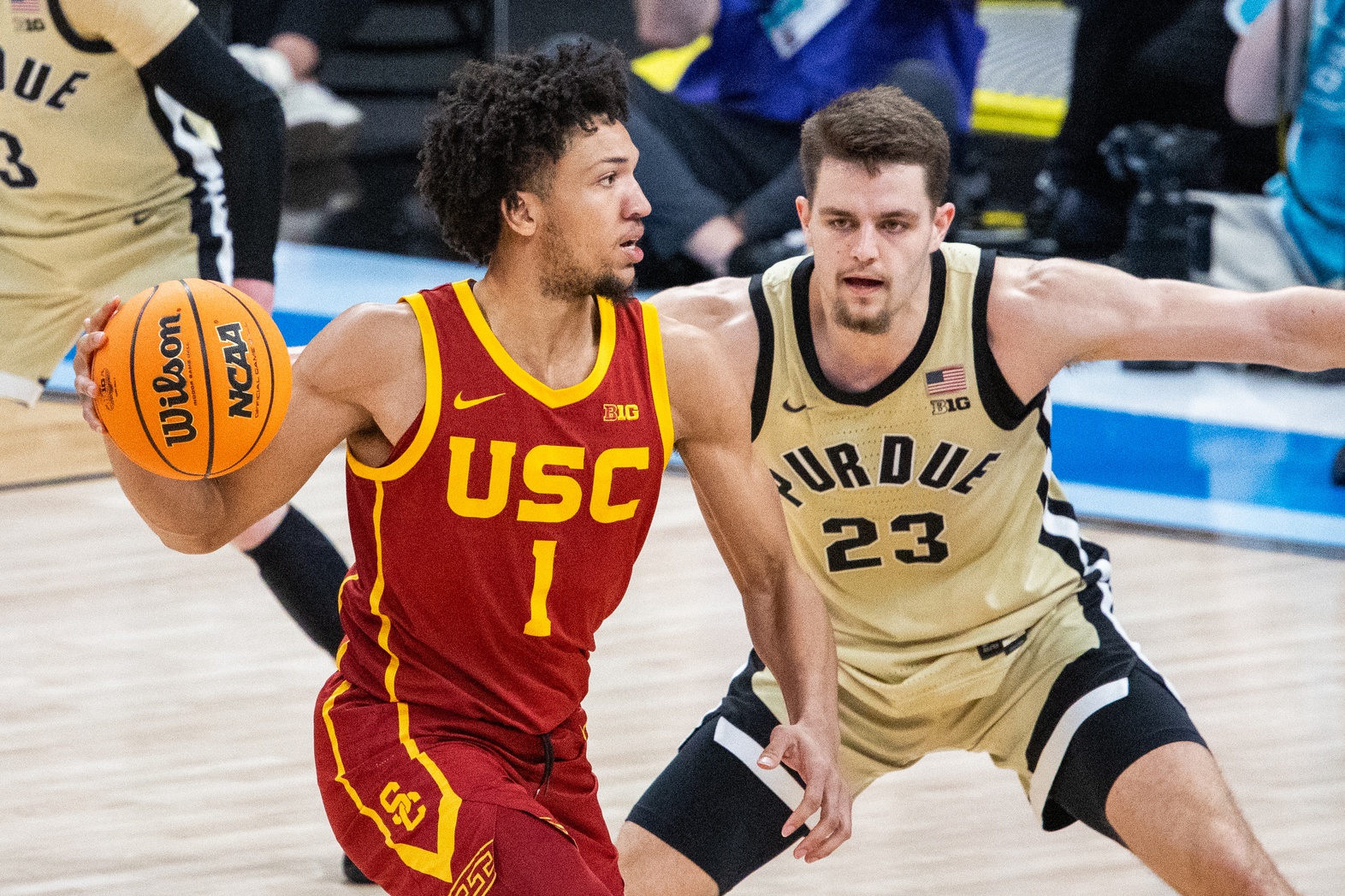 USC Trojans guard Desmond Claude (1) passes the ball while Purdue Boilermakers forward Camden Heide (23) defends in the second half at Gainbridge Fieldhouse.