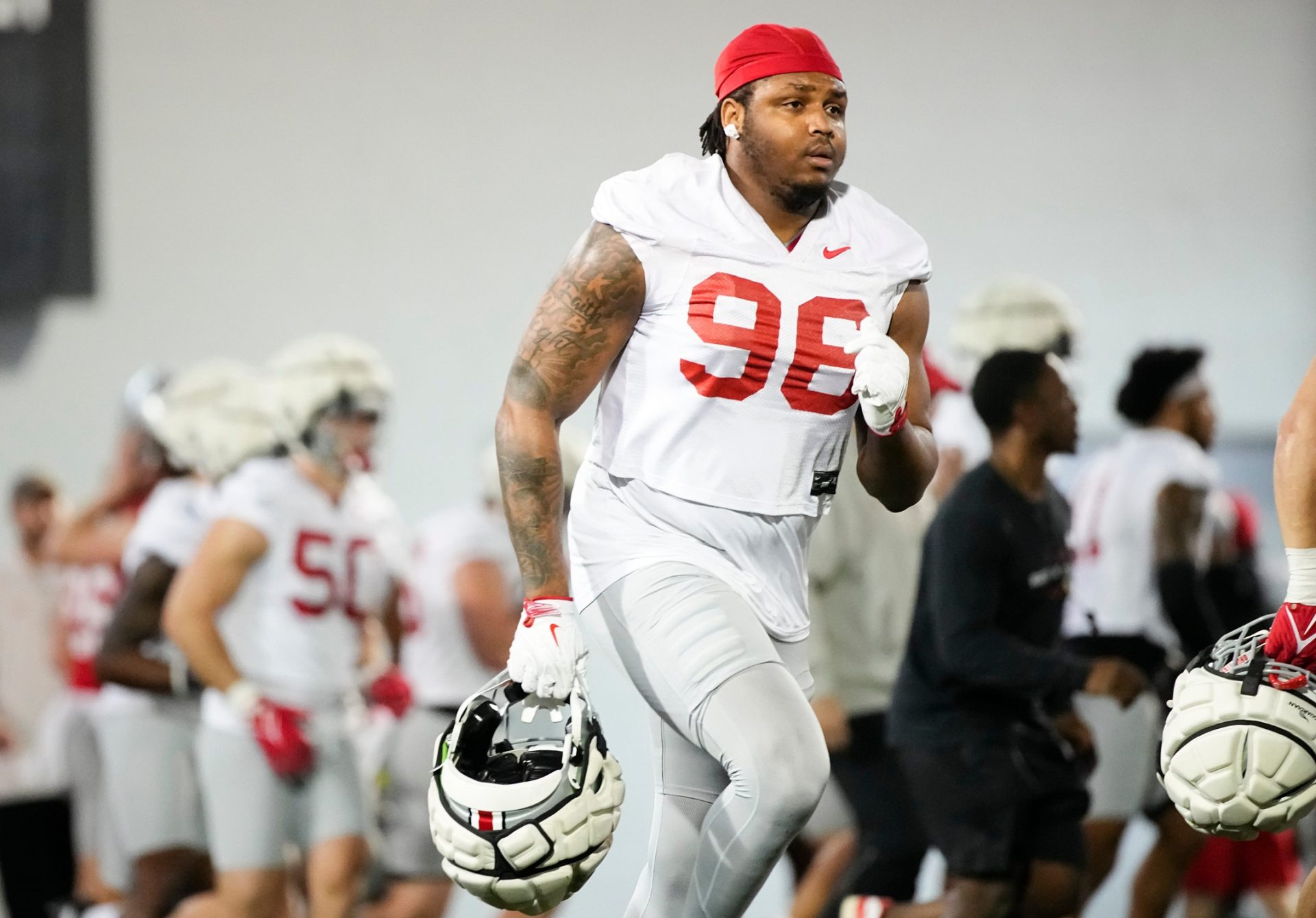 Ohio State Buckeyes defensive end Eddrick Houston (96) runs during spring football practice at the Woody Hayes Athletic Center in Columbus on March 19, 2025.