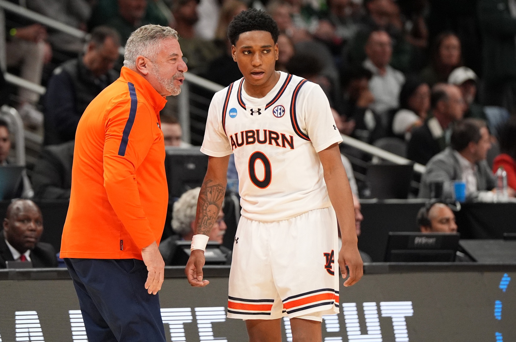 Auburn Tigers head coach Bruce Pearl talks to Auburn Tigers guard Tahaad Pettiford (0) during the second half in the South Regional final of the 2025 NCAA tournament against the Michigan State Spartans at State Farm Arena.