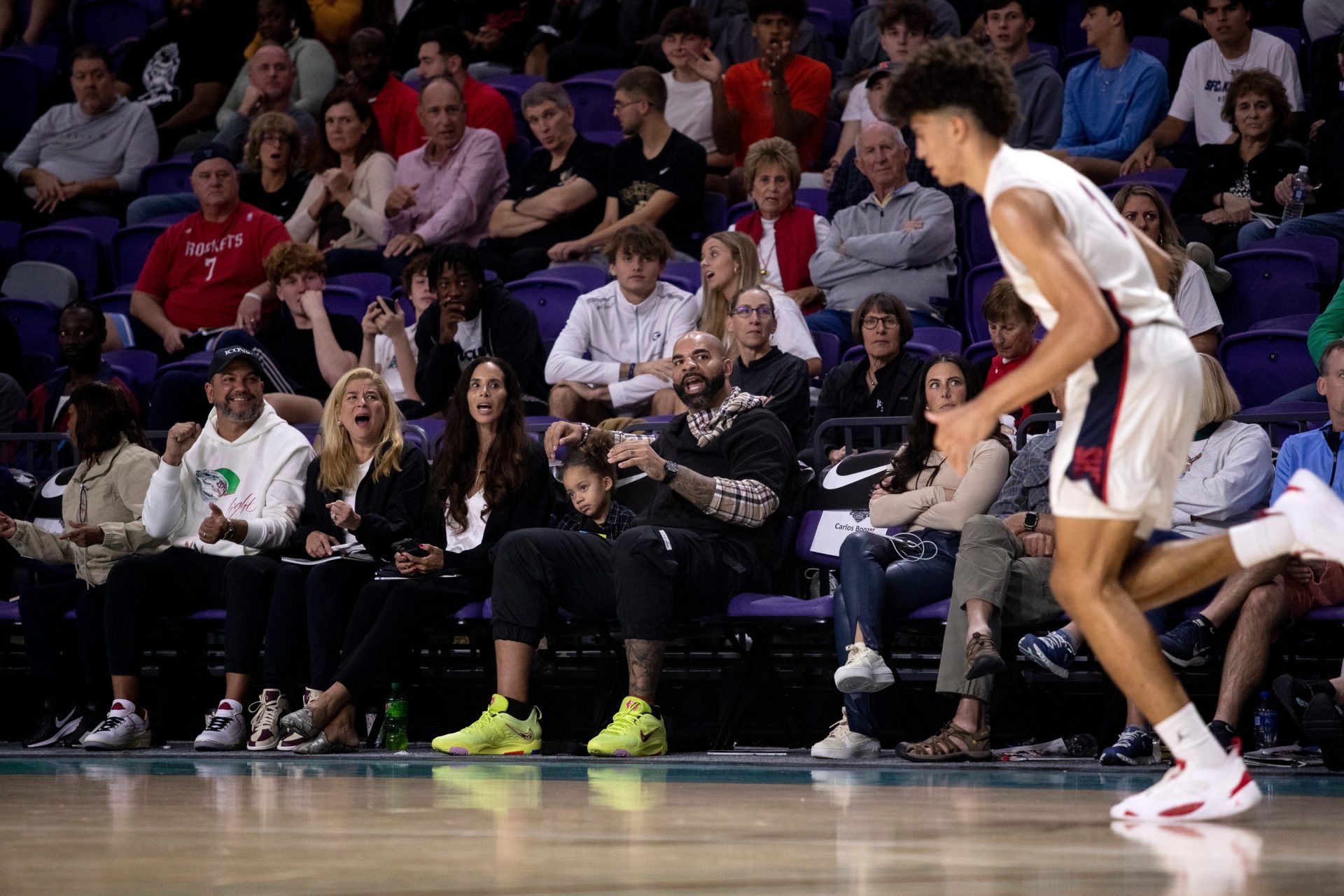Carlos Boozer cheers for his sons, Cameron and Cayden, during their game against Myers Park in the City of Palms Classic on Monday, Dec. 19, 2022, at Suncoast Credit Union Arena in Fort Myers.

Fnp 121922 Ai Cop Boozer 1