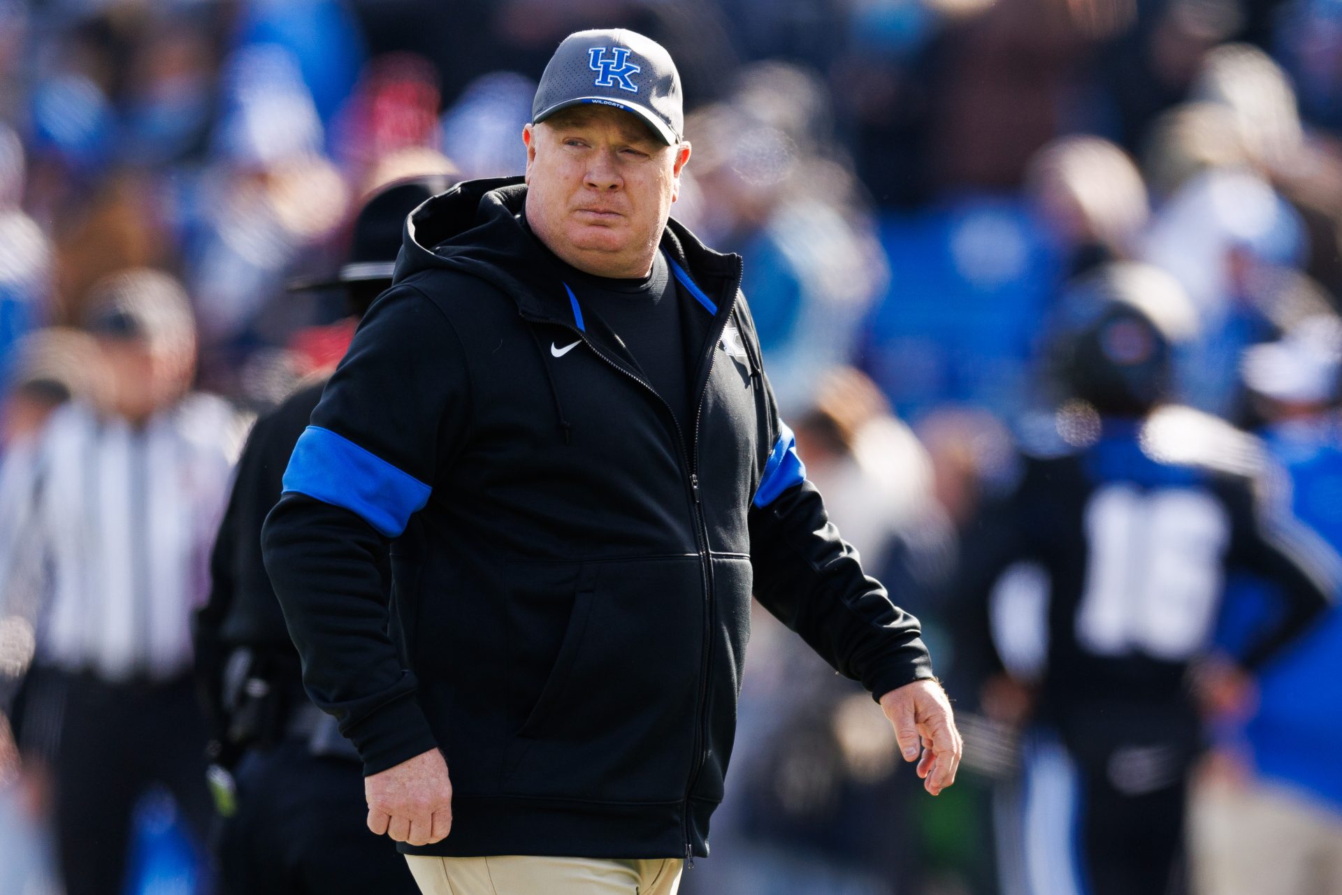 Kentucky Wildcats head coach Mark Stoops walks onto the field before the game against the Louisville Cardinals at Kroger Field.