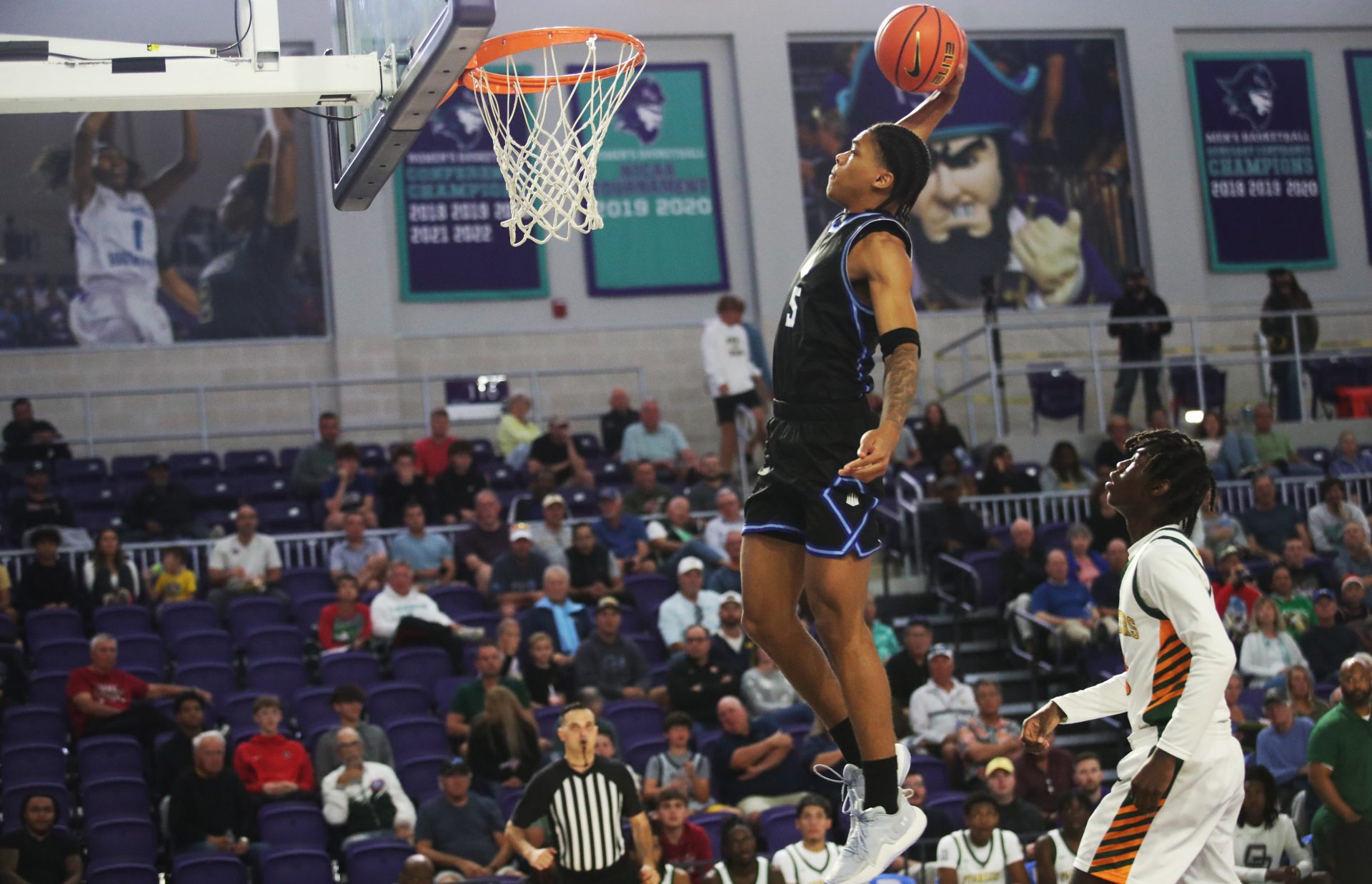 Darius Acuff Jr. from IMG Academy dunks against Oak Ridge during the third place game at the City of Palms Classic at Suncoast Credit Union Arena in Fort Myers on Monday, Dec. 23, 2024. IMG won.