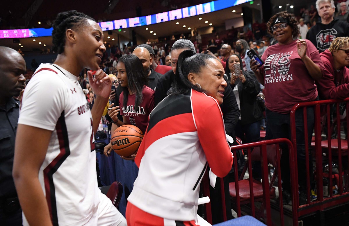 South Carolina Coach Dawn Staley and South Carolina forward Ashlyn Watkins (2) walk to the locker room by fans after the SEC Women's Basketball Tournament game at Bon Secours Wellness Arena in Greenville, S.C. Friday, March 3, 2023. South Carolina won 93-66.

University Of South Carolina Vs Arkansas 2023 Sec Women S Basketball Tournament In Greenville Sc