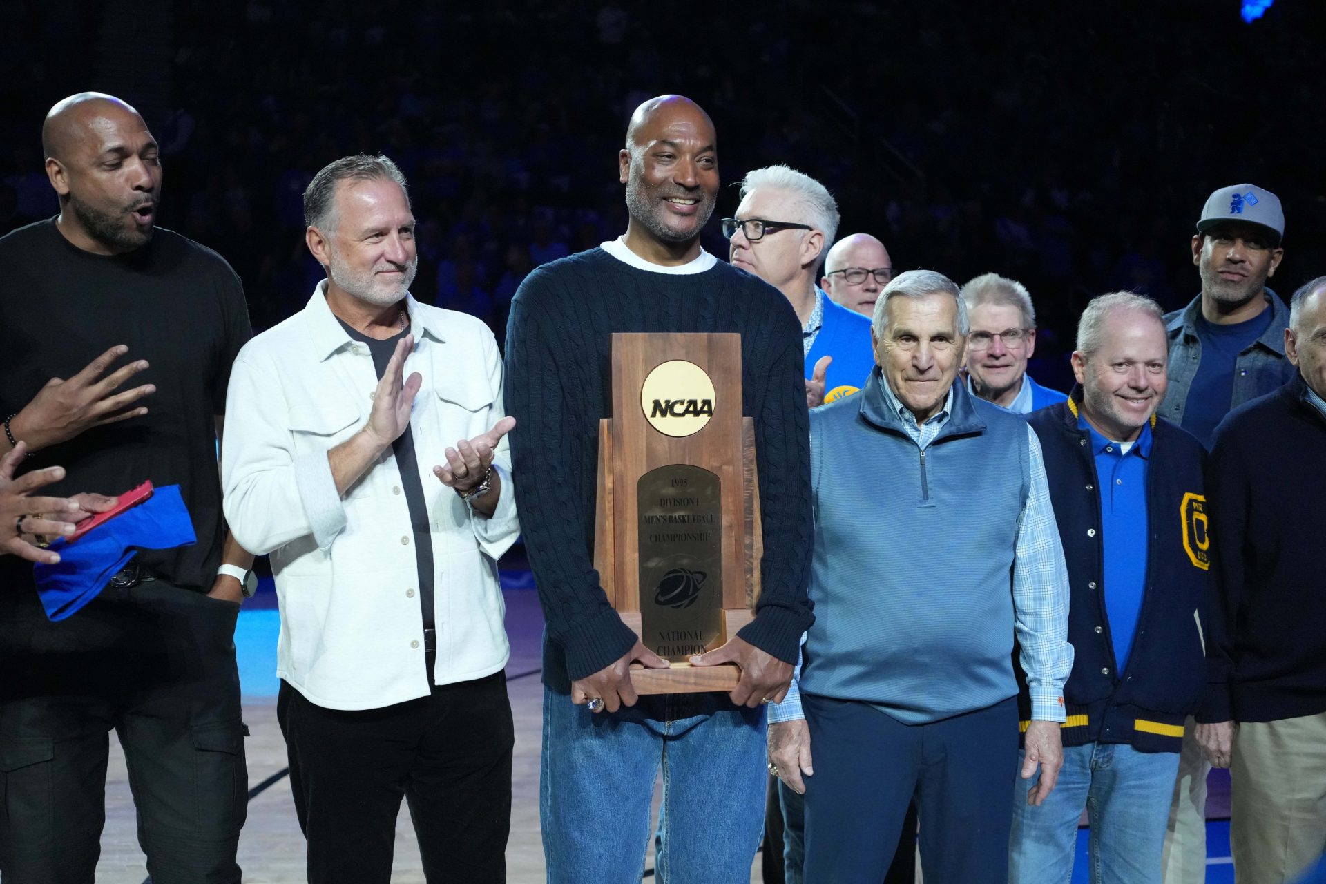 Members of the UCLA Bruins 1995 NCAA championship team including Charles O'Bannon, Ed O'Bannon and coach Jim Harrick pose at Pauley Pavilion presented by Wescom.