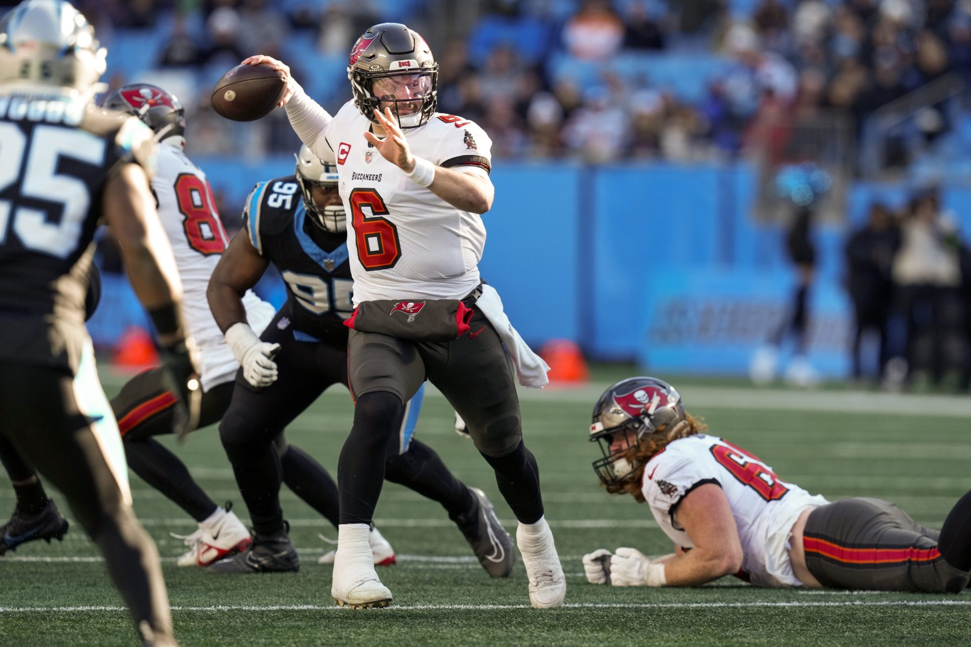 Tampa Bay Buccaneers quarterback Baker Mayfield (6) makes a throw against  Carolina Panthers defensive tackle Derrick Brown (95) during the second half at Bank of America Stadium.